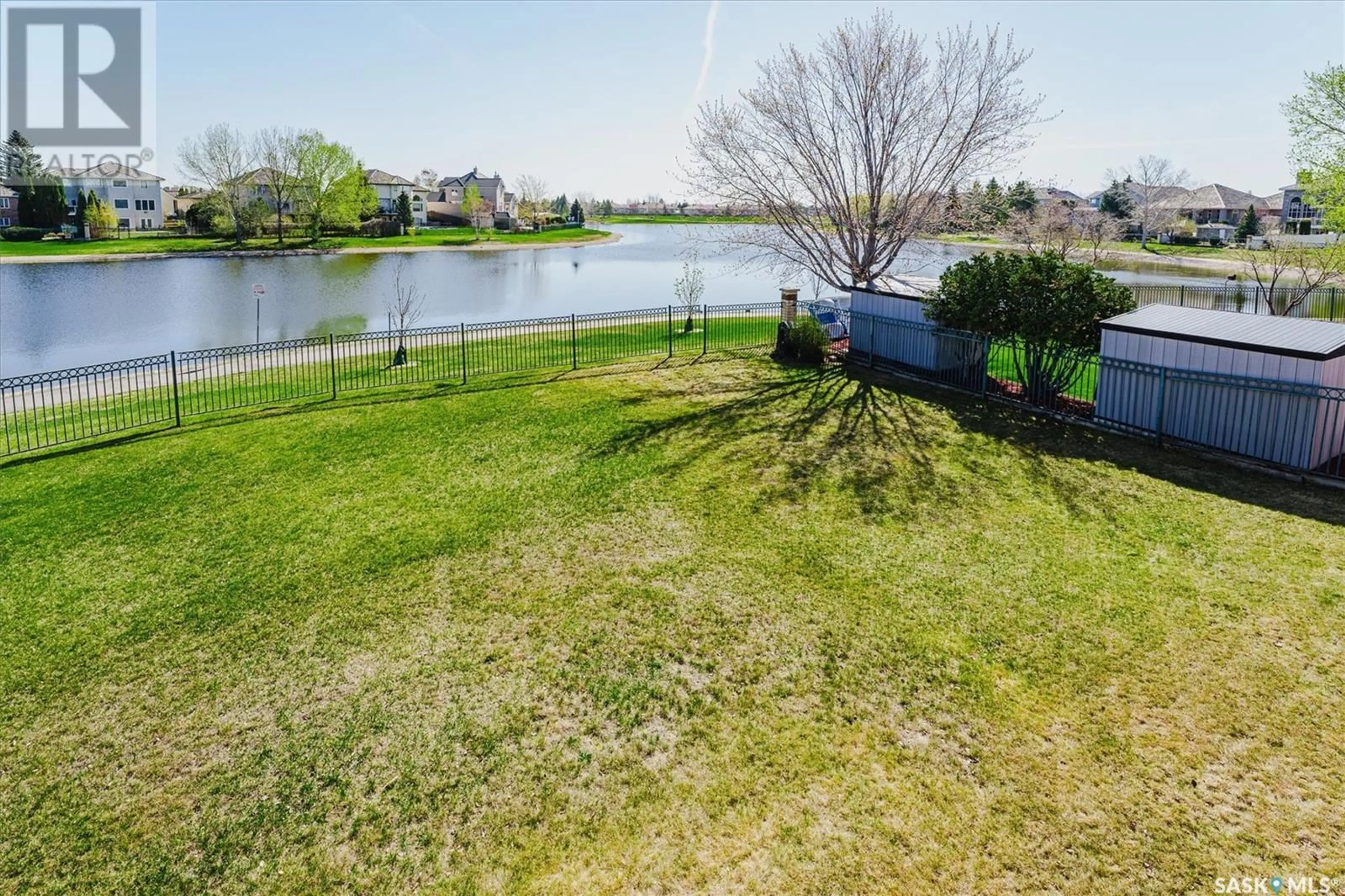 A pic from exterior of the house or condo, the fenced backyard for 415 Braeside BAY, Saskatoon Saskatchewan S7V1A3