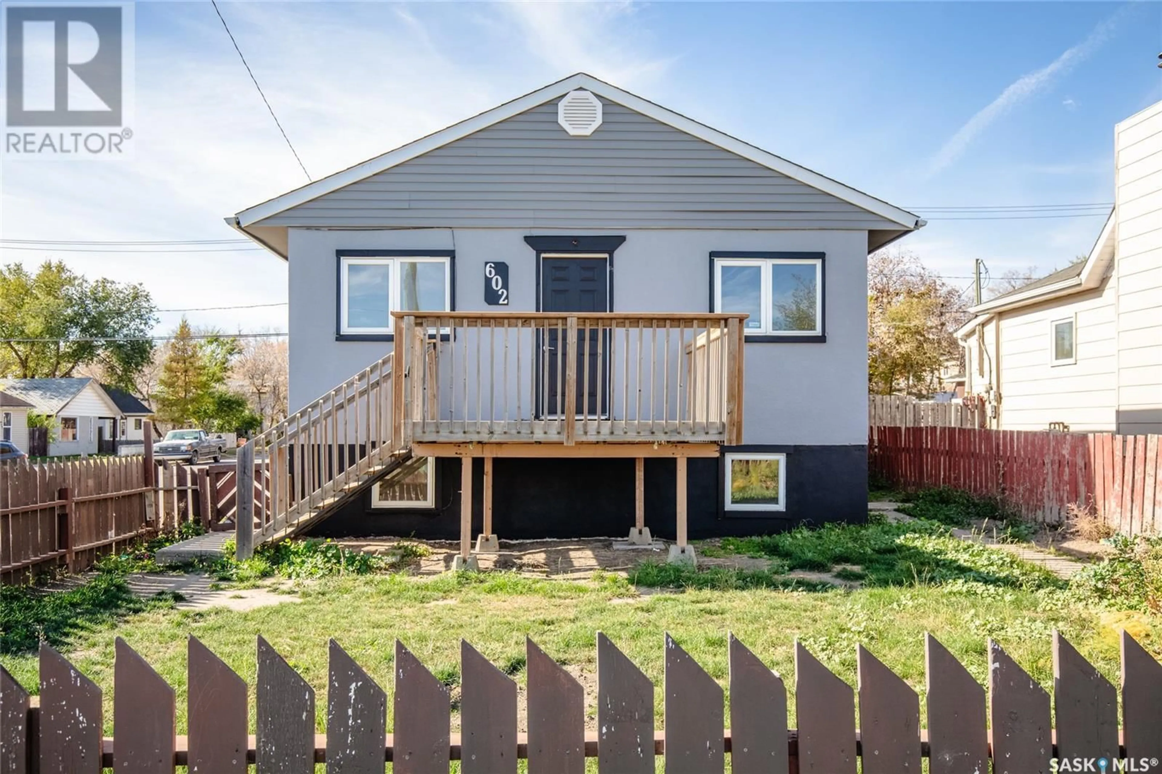 Frontside or backside of a home, the fenced backyard for 602 9th AVENUE NW, Moose Jaw Saskatchewan S6H4H8