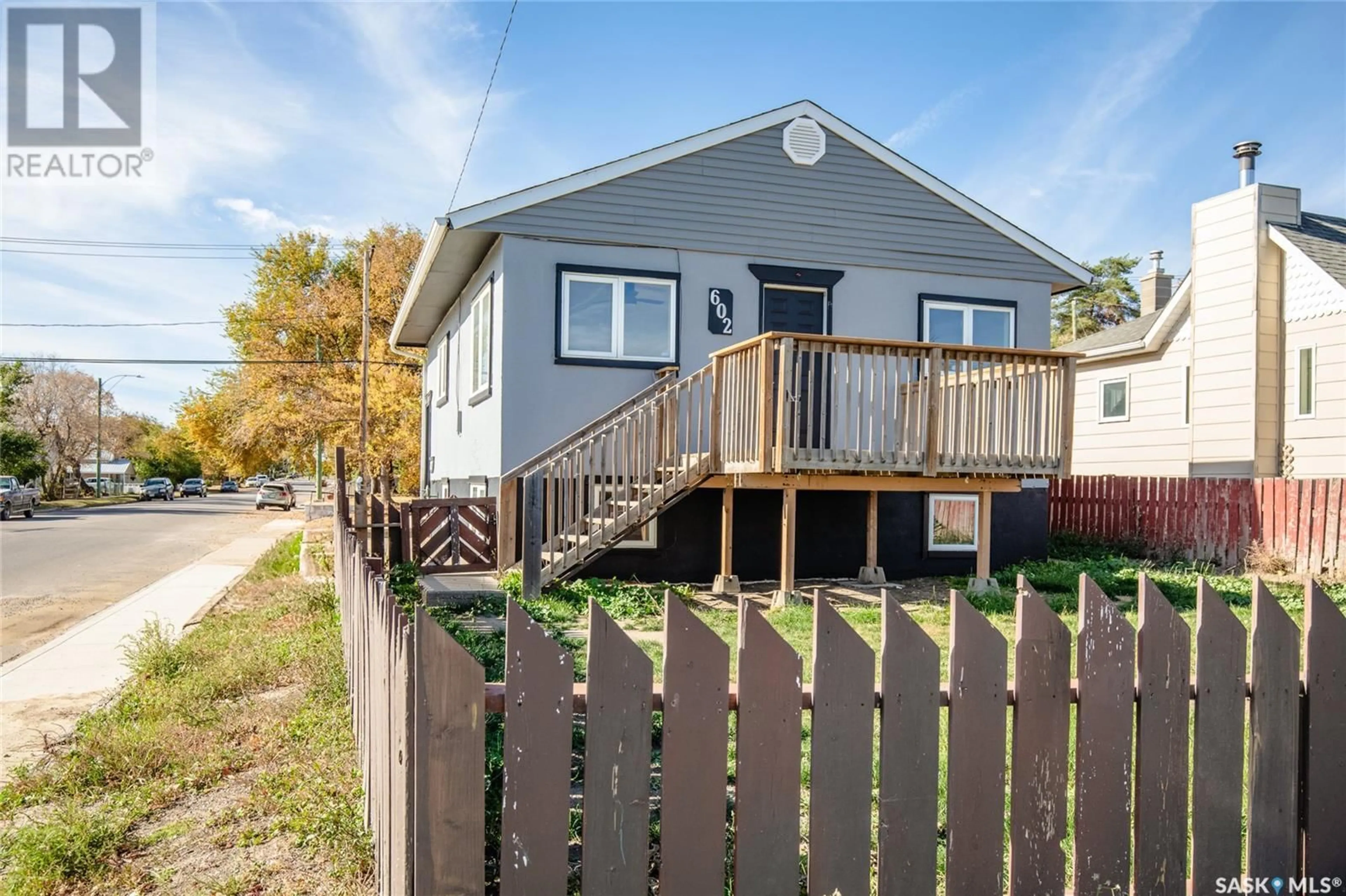 Frontside or backside of a home, the fenced backyard for 602 9th AVENUE NW, Moose Jaw Saskatchewan S6H4H8