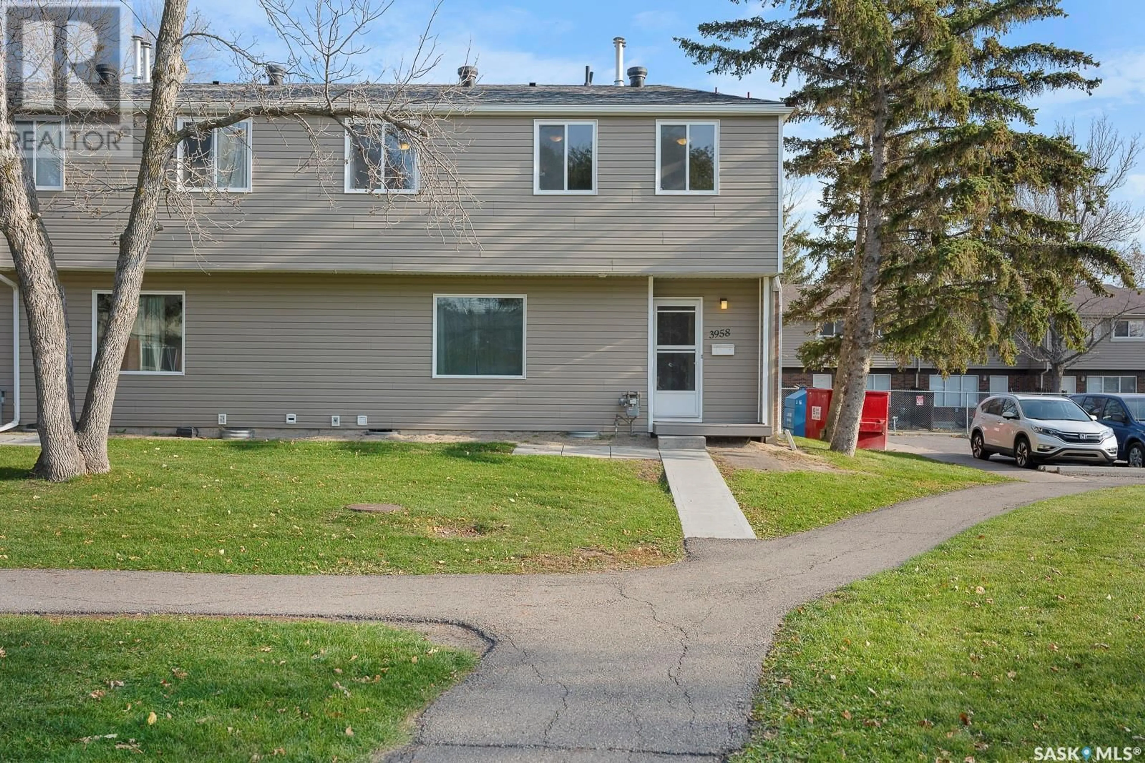 A pic from exterior of the house or condo, the fenced backyard for 3958 CASTLE ROAD, Regina Saskatchewan S4S6A4