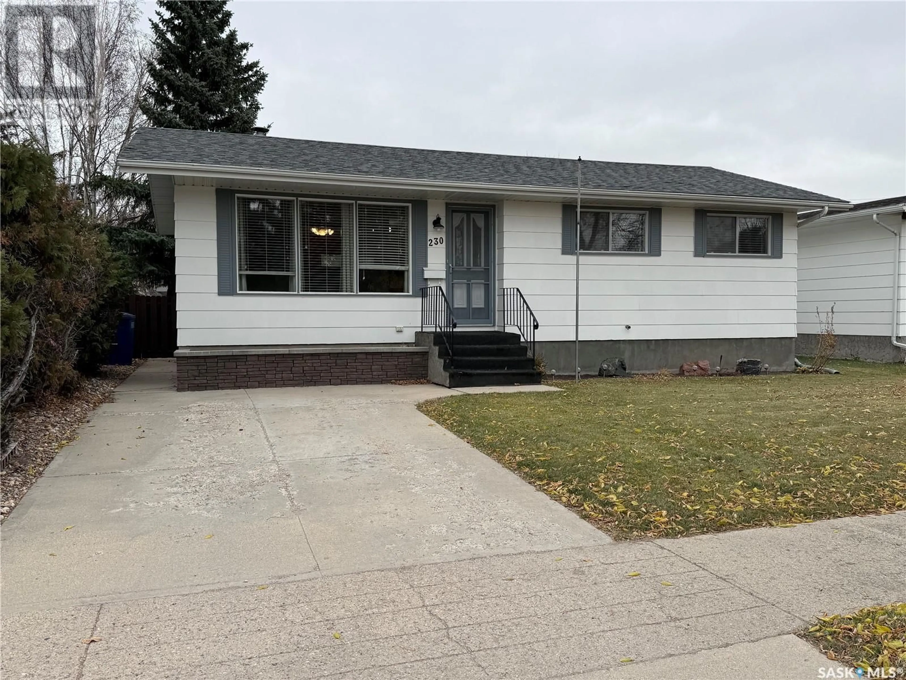 Home with vinyl exterior material, street for 230 10TH STREET, Humboldt Saskatchewan S0K2A0