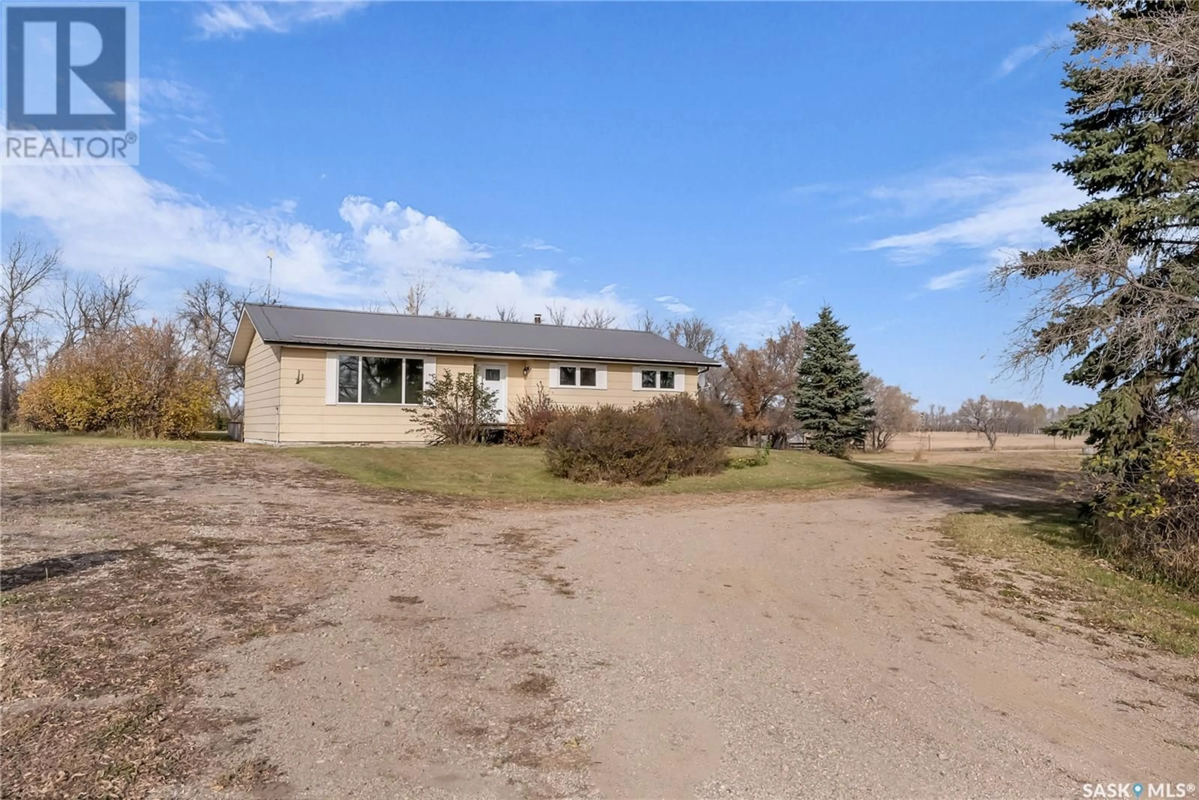 Frontside or backside of a home, the fenced backyard for Trotchie Acreage, Corman Park Rm No. 344 Saskatchewan S0K0J0