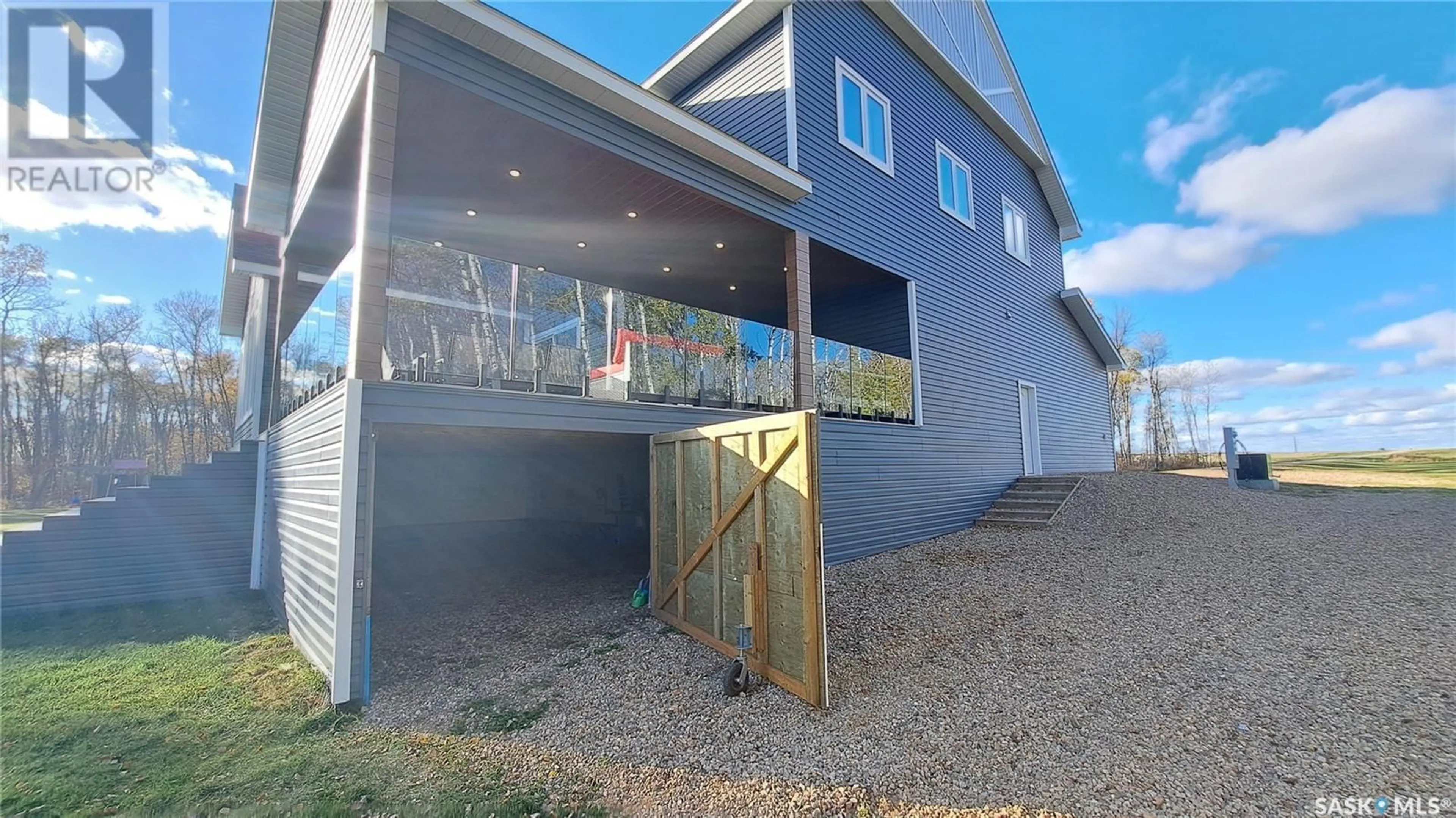 A pic from exterior of the house or condo, the fenced backyard for Little Loon Acreage, Parkdale Rm No. 498 Saskatchewan S0M0Y0