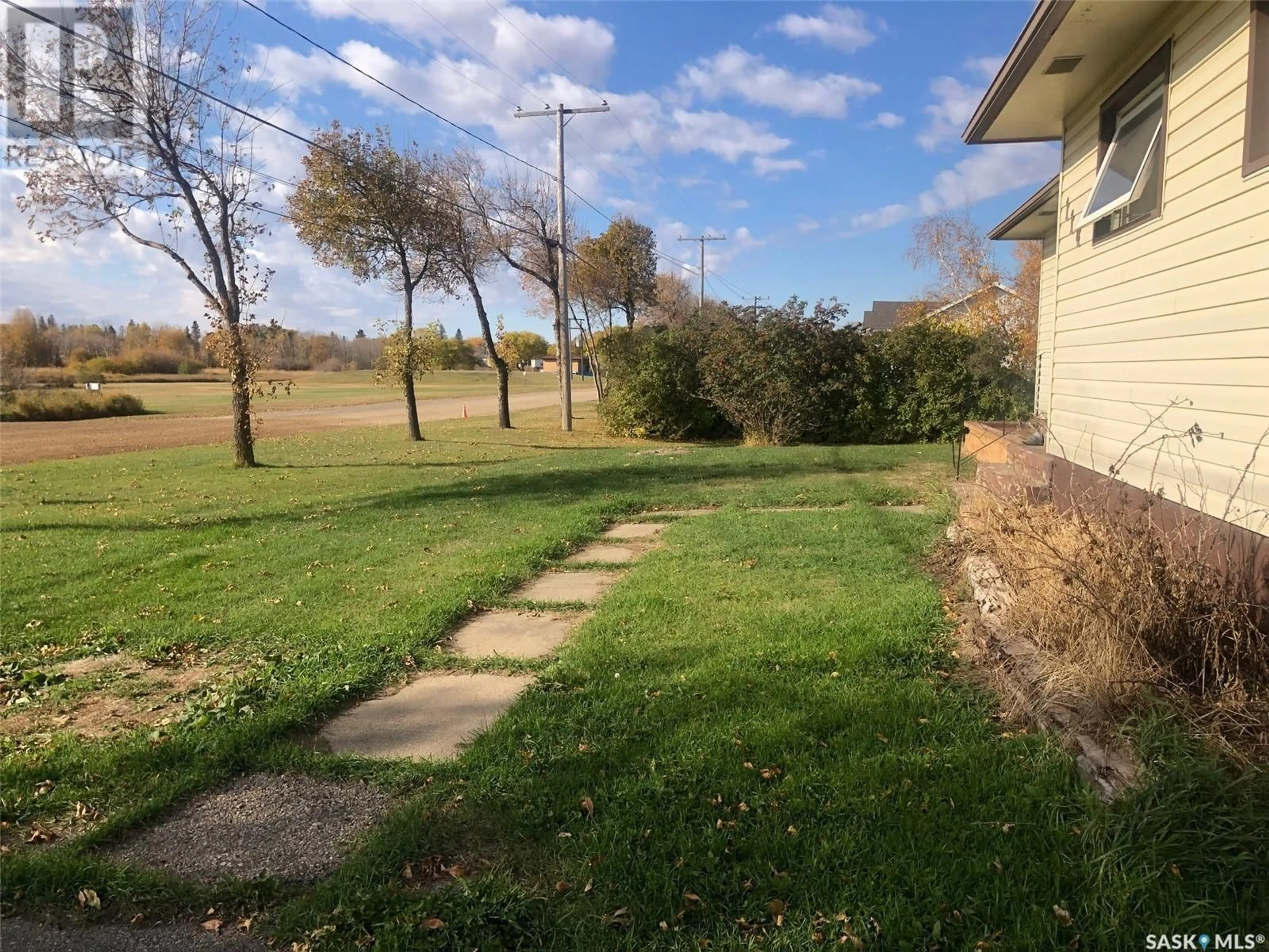 A pic from exterior of the house or condo, the fenced backyard for 114 Whitesand DRIVE, Canora Saskatchewan S0A0L0