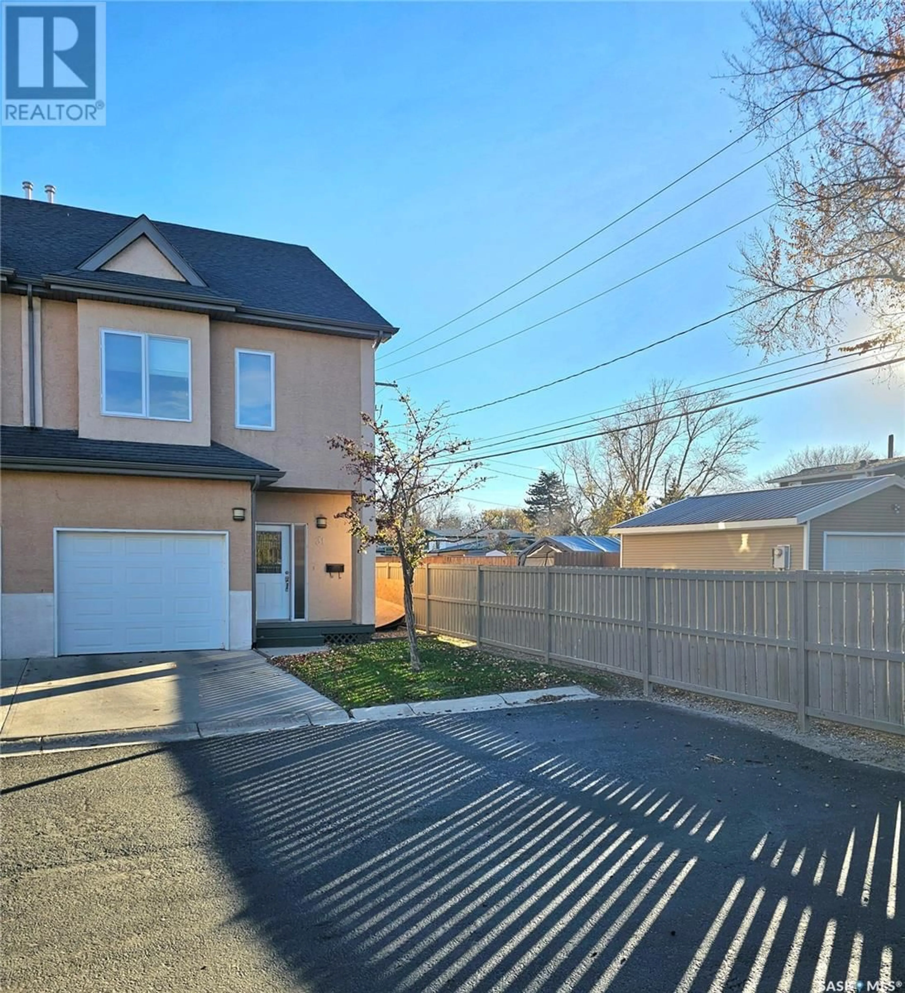 Frontside or backside of a home, the fenced backyard for 31 701 McIntosh STREET E, Swift Current Saskatchewan S9H1H7