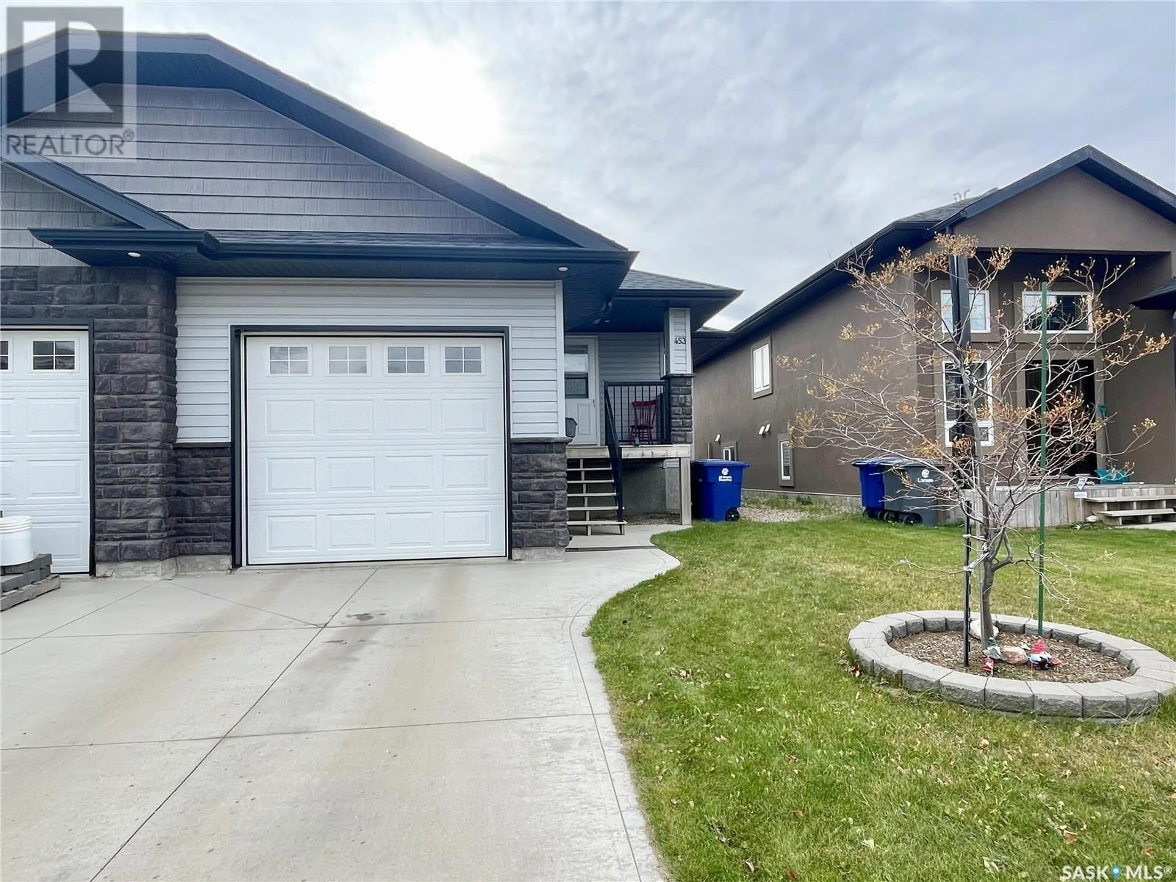 Frontside or backside of a home, the street view for 453 REDWOOD CRESCENT, Warman Saskatchewan S0K4S2