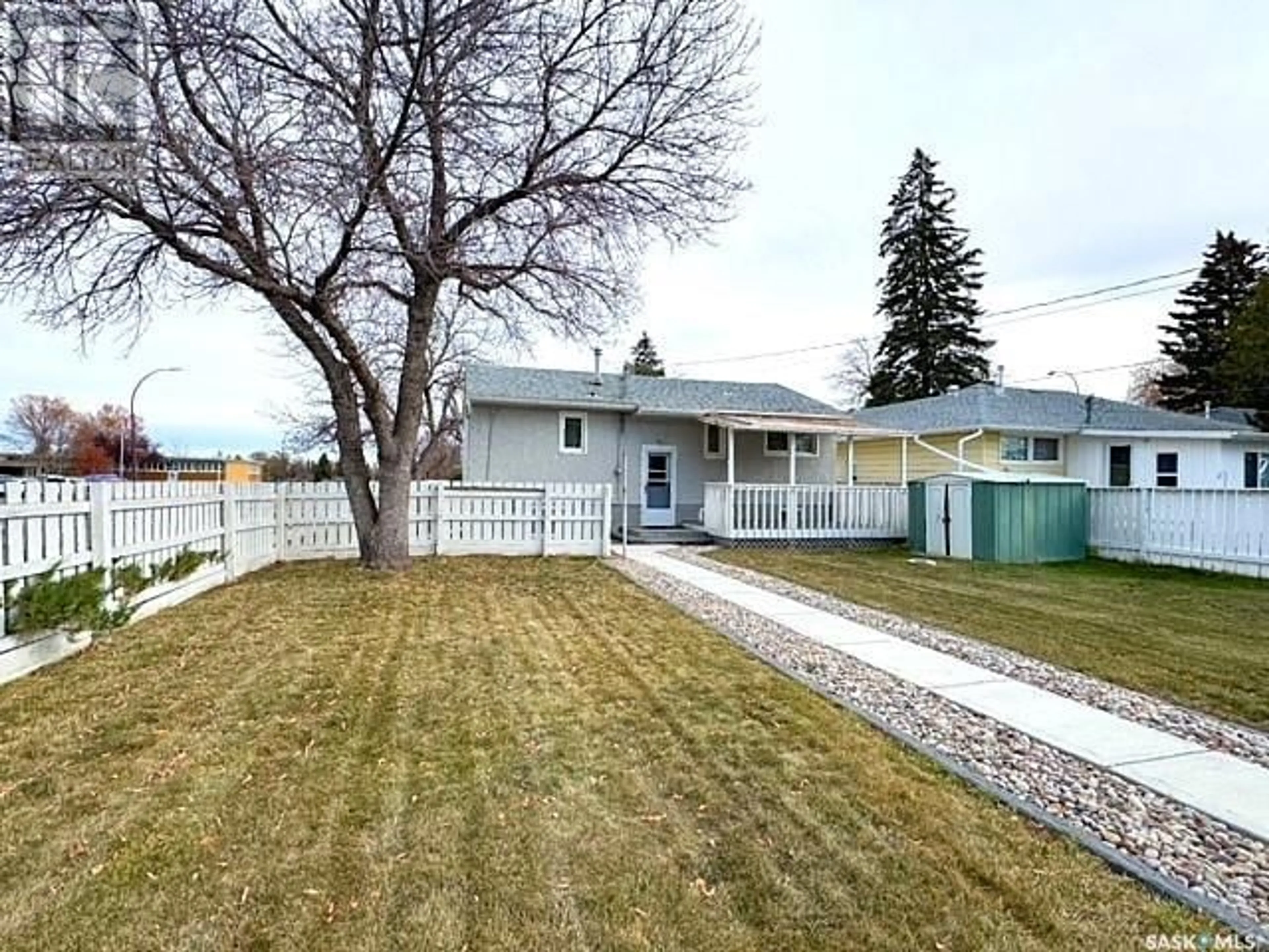 Frontside or backside of a home, the fenced backyard for 890 9th AVENUE NE, Swift Current Saskatchewan S9H2S7