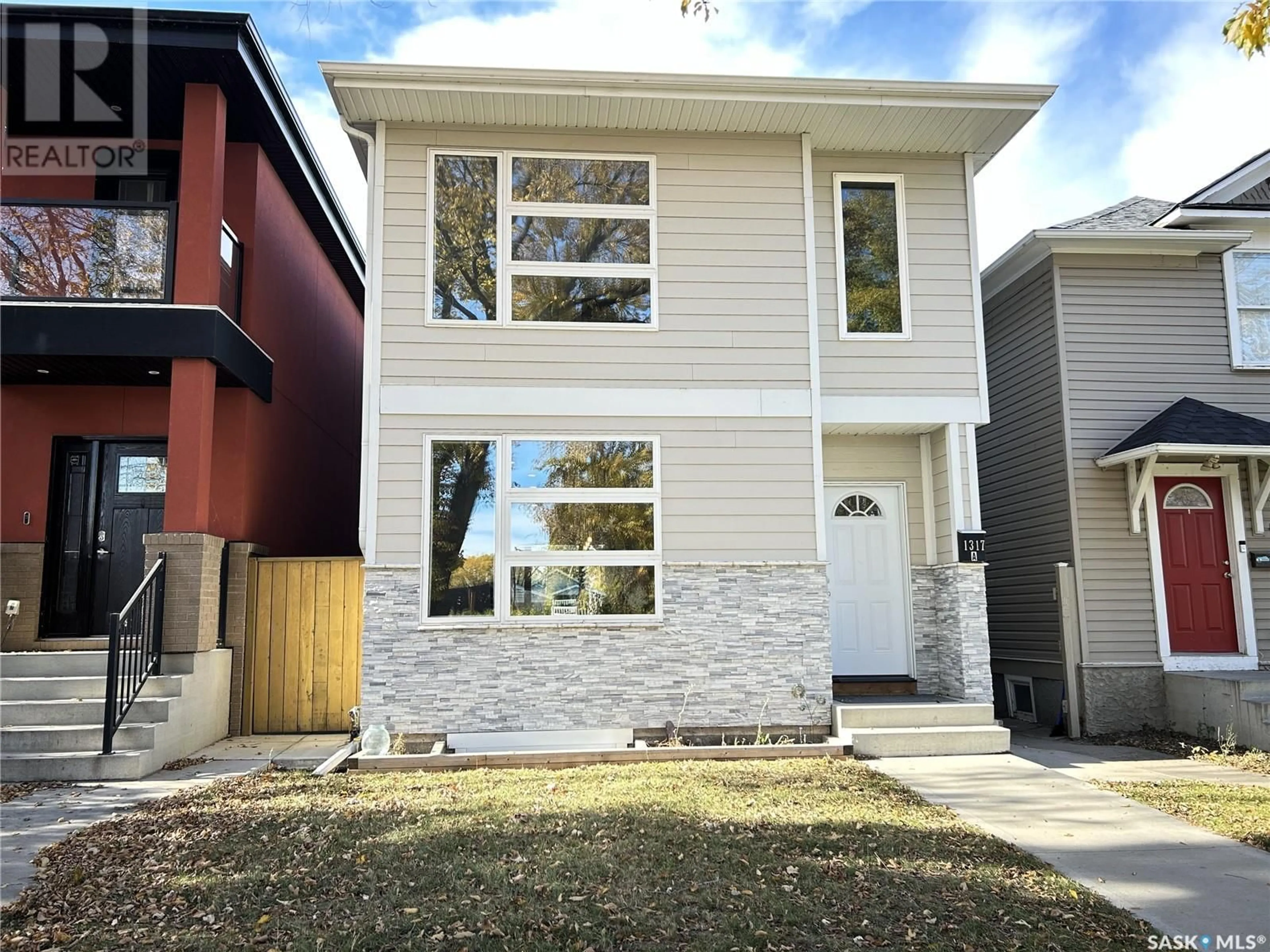 Frontside or backside of a home, the fenced backyard for 1317 8th AVENUE N, Saskatoon Saskatchewan S7K2X5