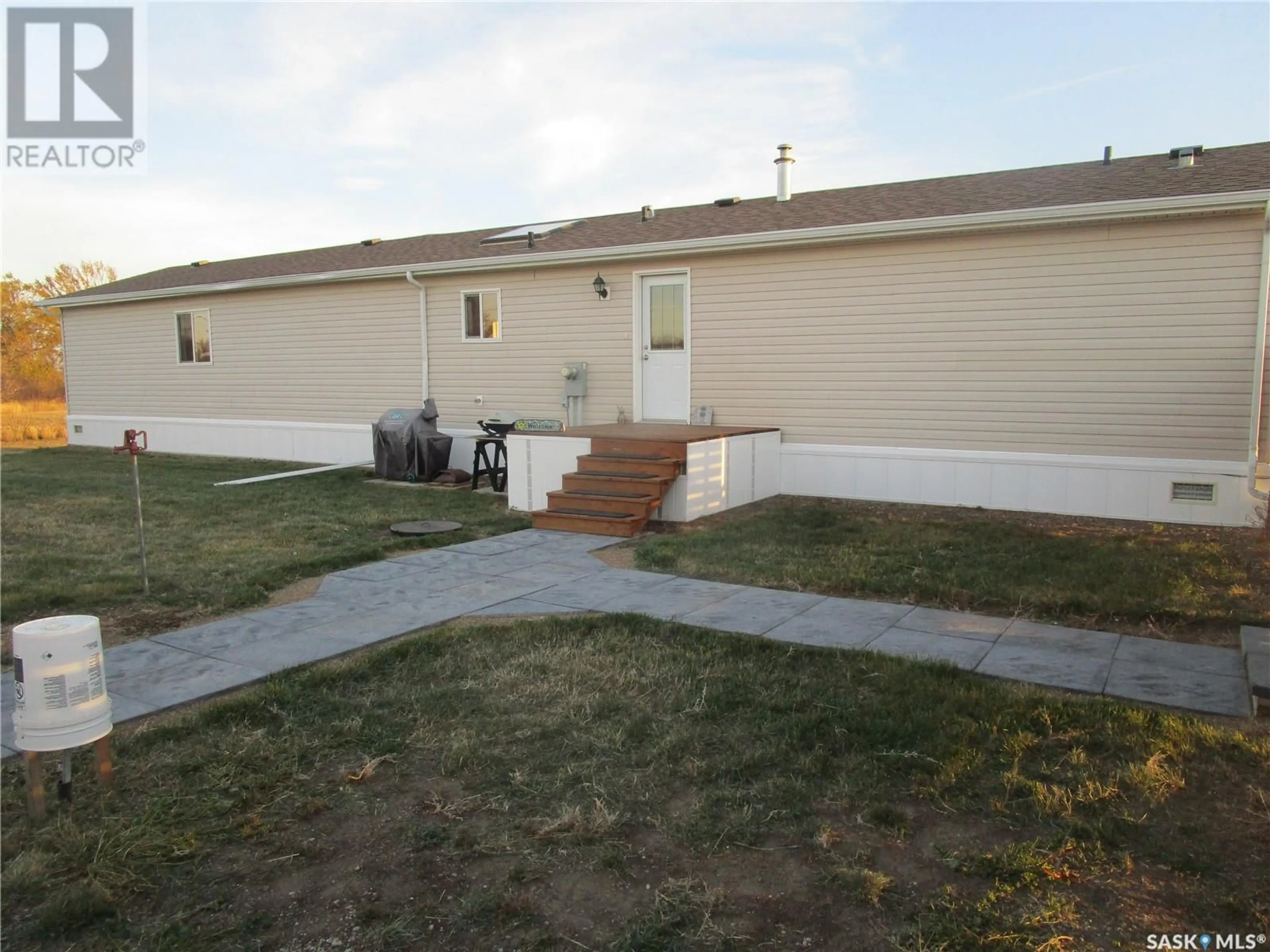 Frontside or backside of a home, the fenced backyard for 514 3rd AVENUE, Wood Mountain Saskatchewan S0H4L0