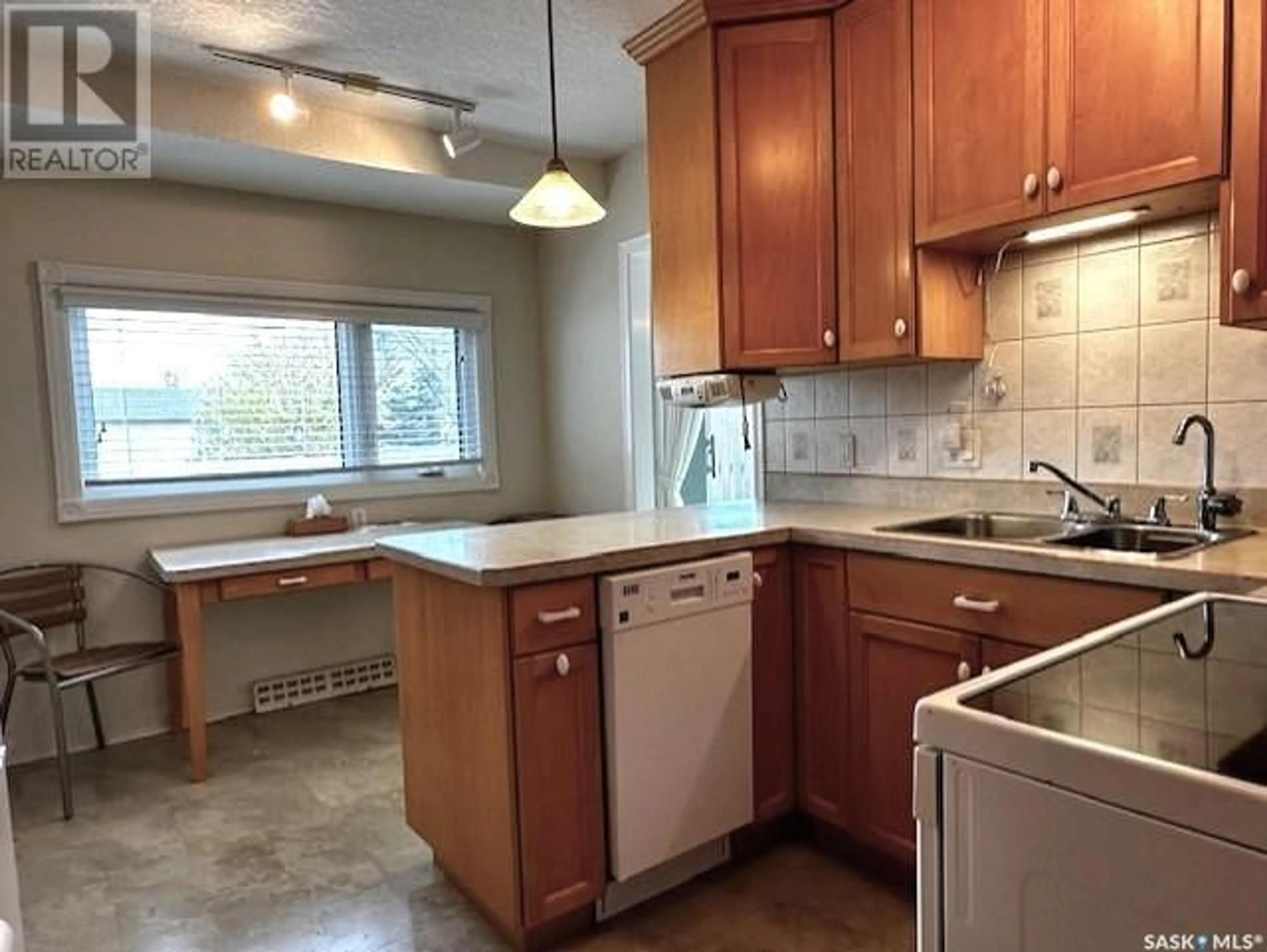 Standard kitchen, wood floors, cottage for 214 10th AVENUE W, Melville Saskatchewan S0A2P0