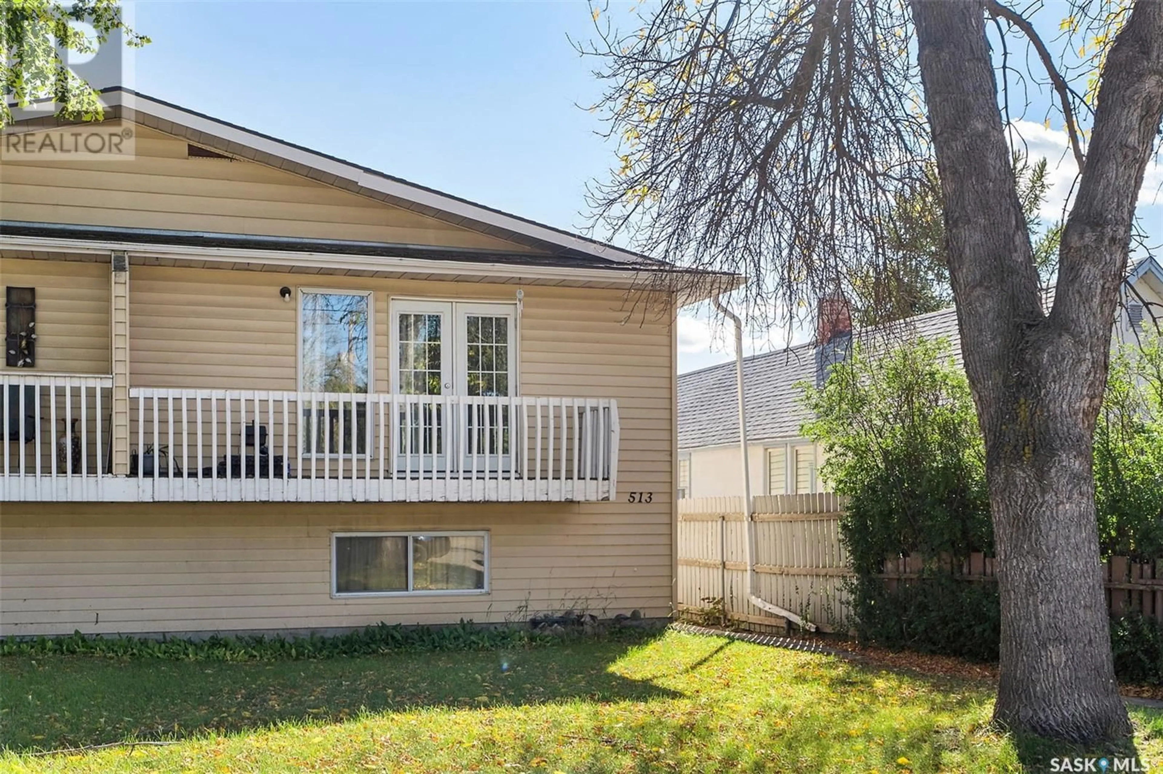 Frontside or backside of a home, the fenced backyard for 513 Empress STREET, Saskatoon Saskatchewan S7K0Y2