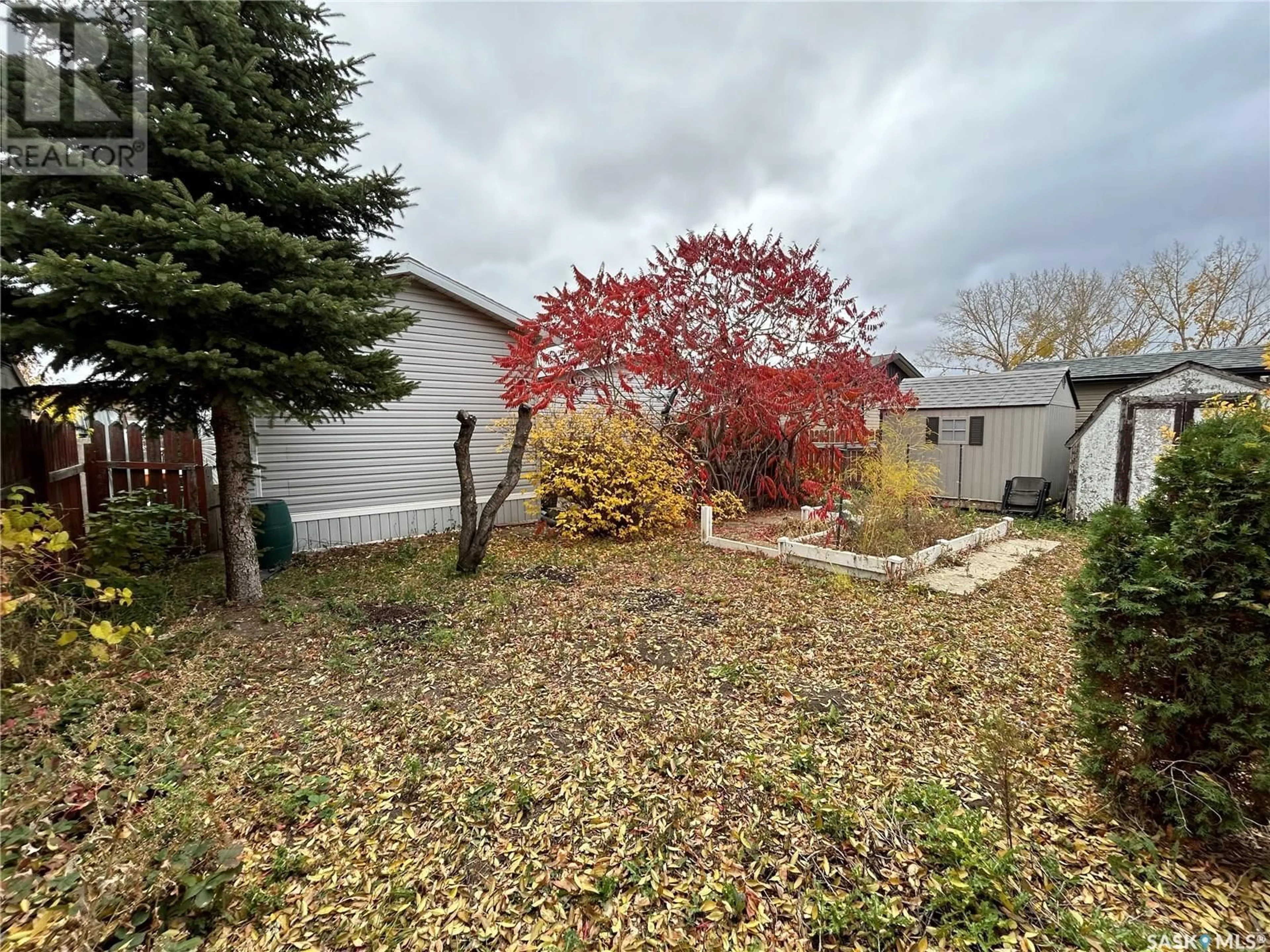 A pic from exterior of the house or condo, the fenced backyard for 109 Laing CRESCENT, Weyburn Saskatchewan S4H2R8