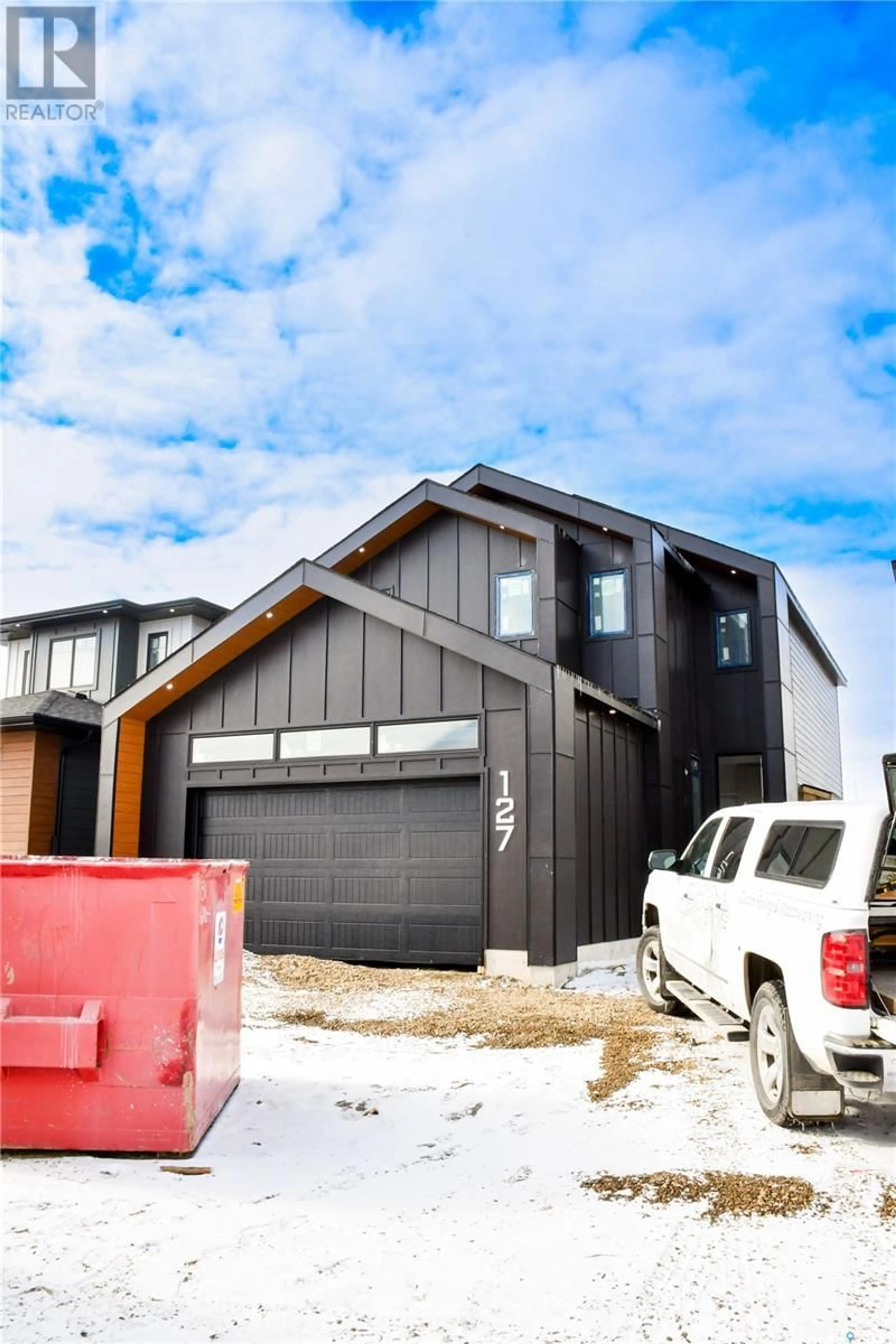 Home with vinyl exterior material, street for 127 ASOKAN STREET, Saskatoon Saskatchewan S7V1S4