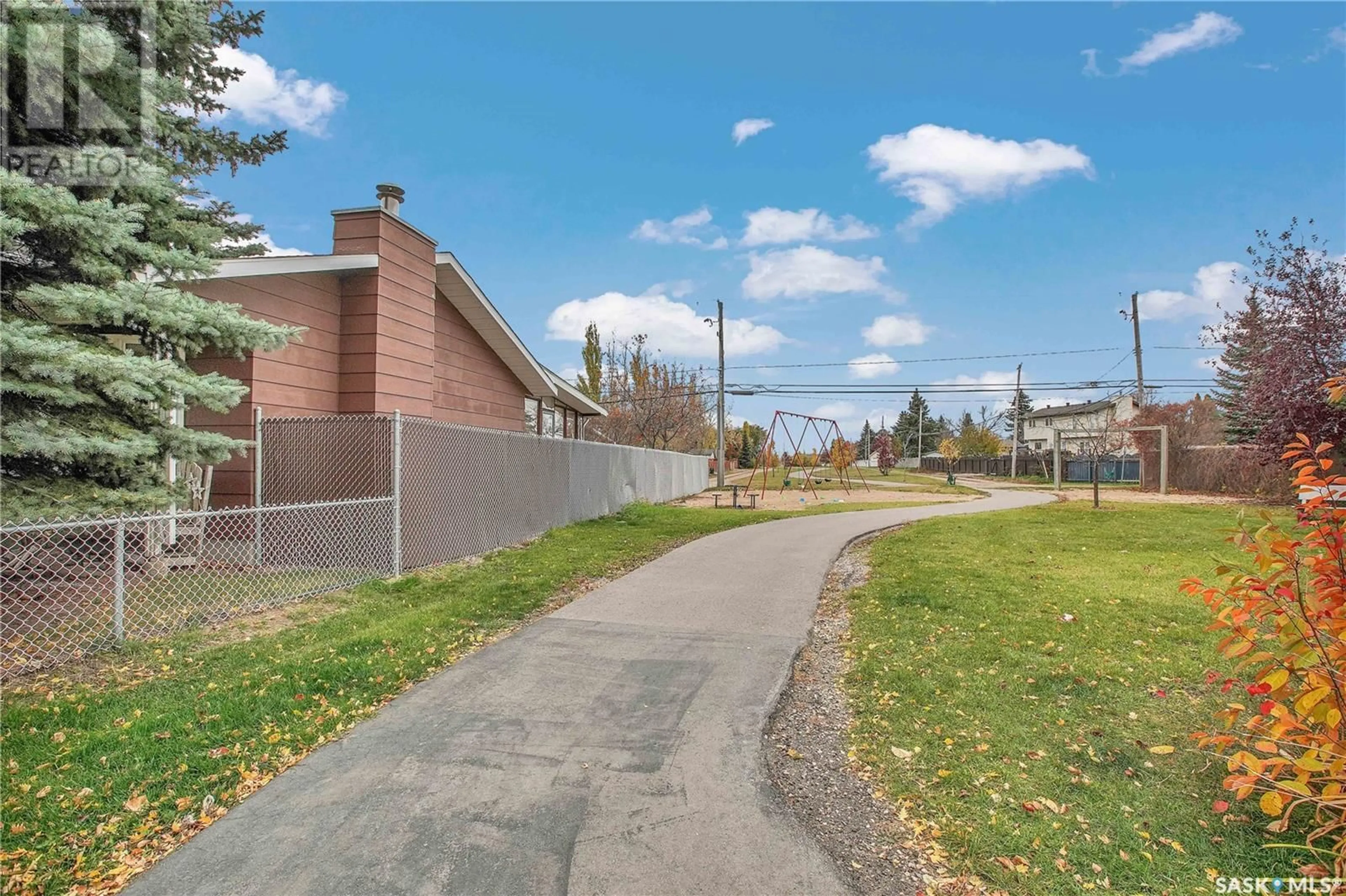 A pic from exterior of the house or condo, the fenced backyard for 702 4th STREET S, Martensville Saskatchewan S0K2T0