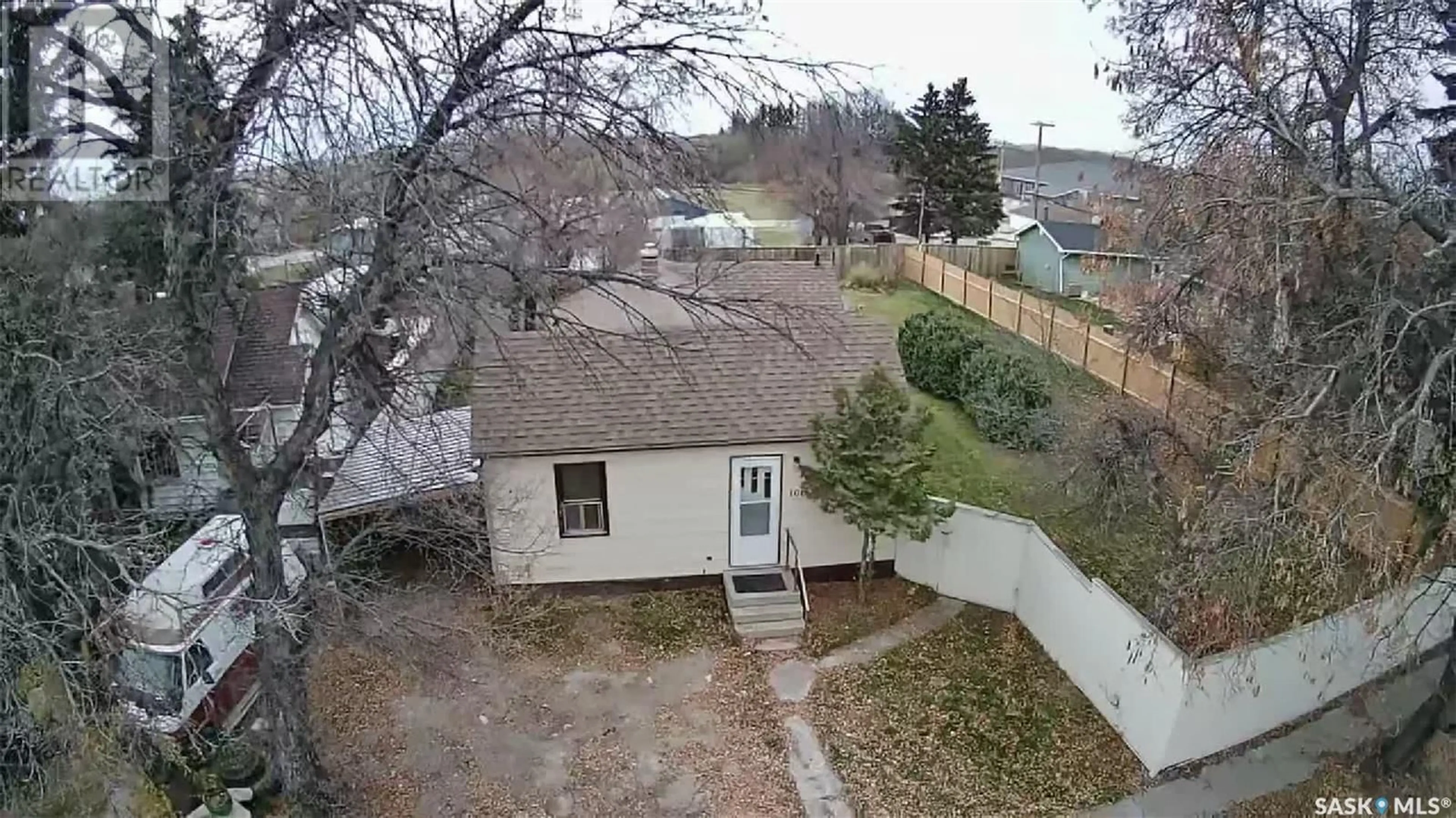 Frontside or backside of a home, the fenced backyard for 106 1st AVENUE, Middle Lake Saskatchewan S0K2X0