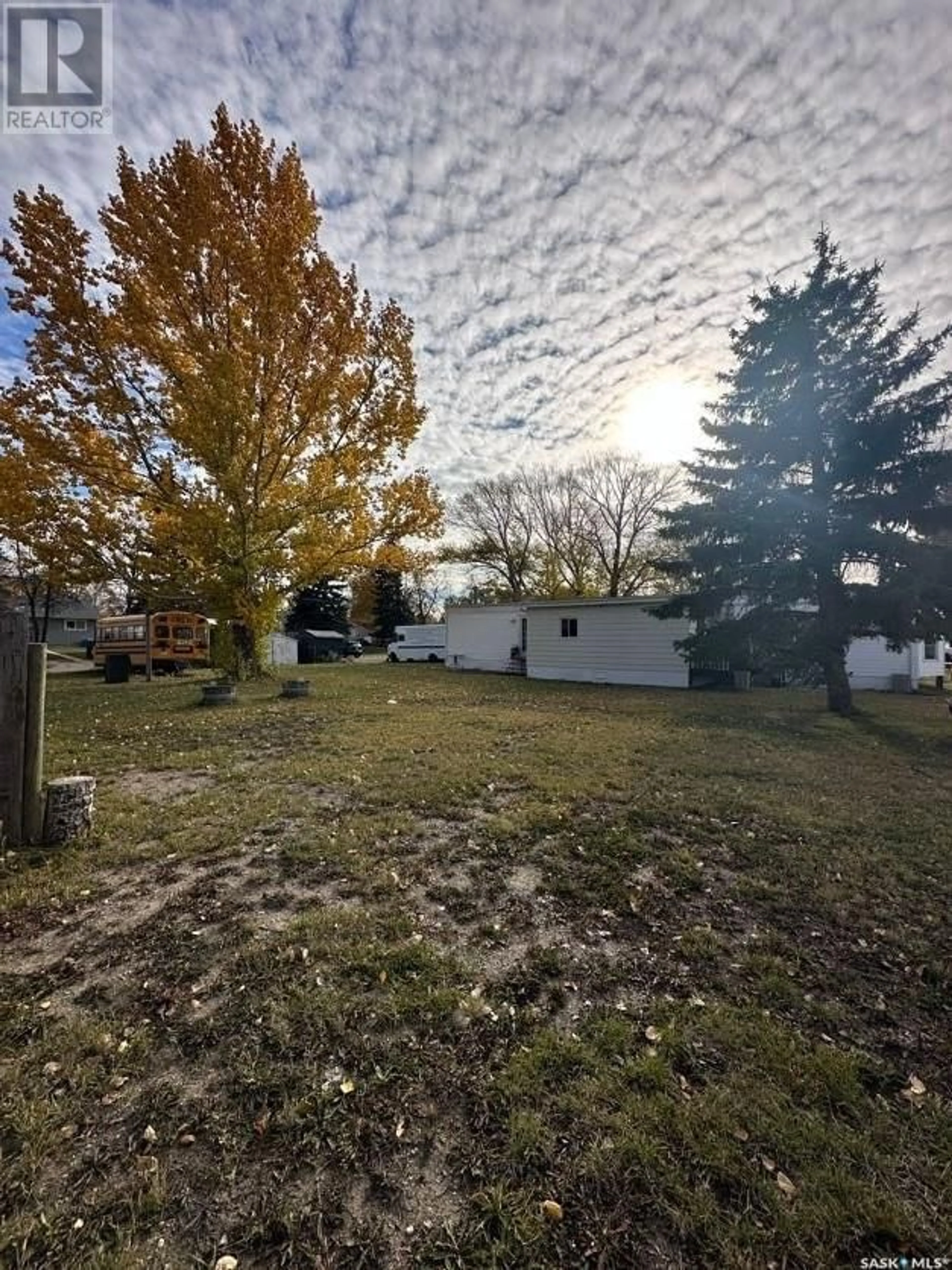 A pic from exterior of the house or condo, the fenced backyard for 308 McGregor STREET, Davidson Saskatchewan S0G1A0