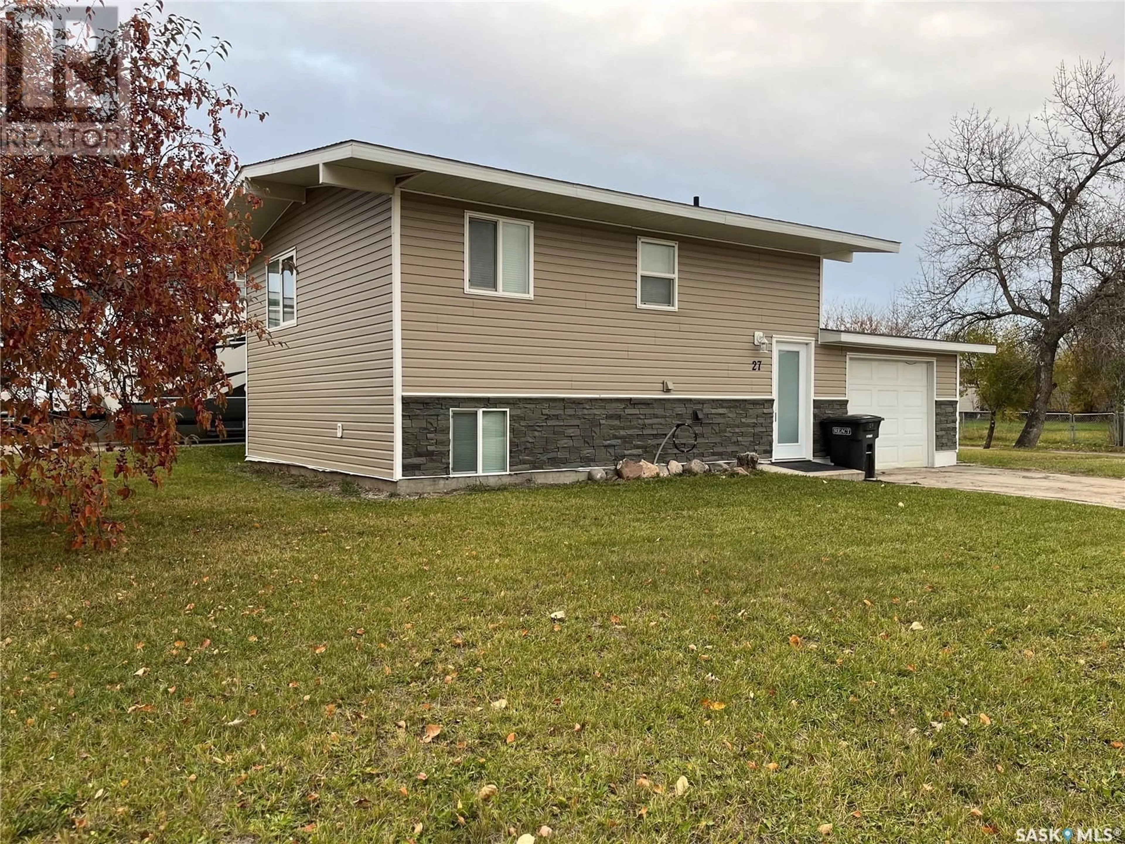 Frontside or backside of a home, the fenced backyard for 27 Calvert CRESCENT, Lanigan Saskatchewan S0K2M0