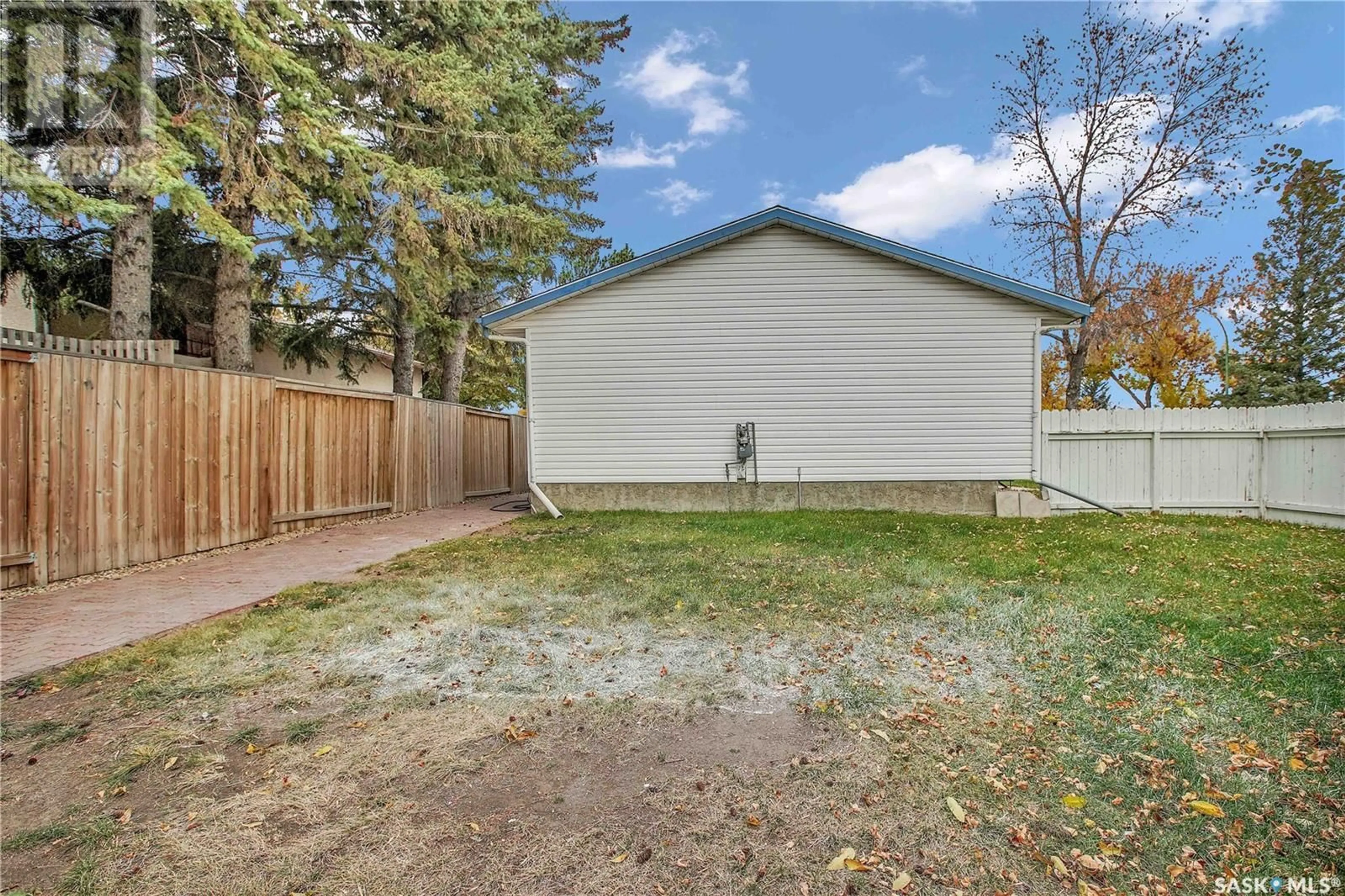 A pic from exterior of the house or condo, the fenced backyard for 401 St Laurent CRESCENT, Saskatoon Saskatchewan S7L4X3