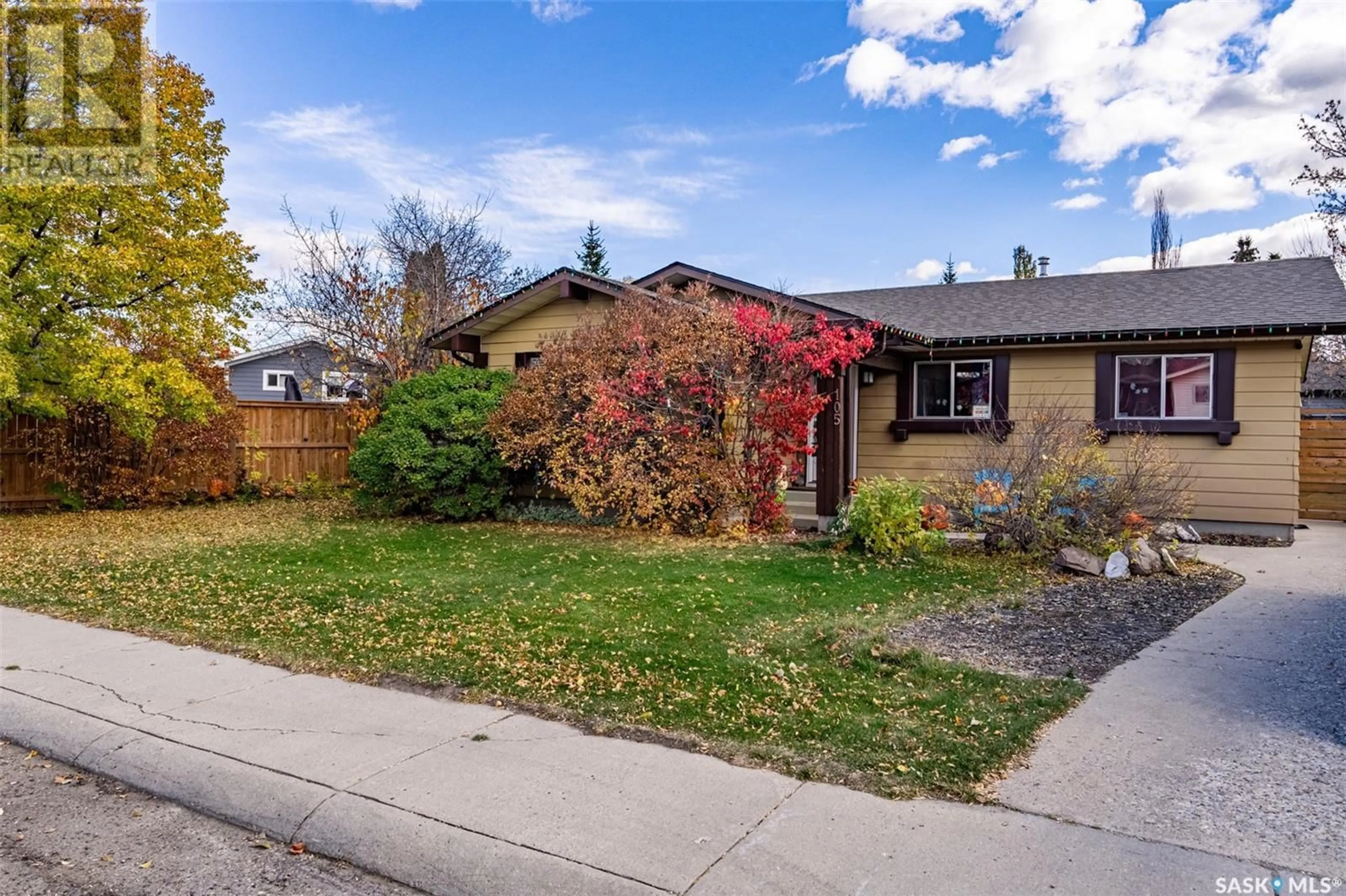 A pic from exterior of the house or condo, the fenced backyard for 105 QUILL CRESCENT, Saskatoon Saskatchewan S7K4T8