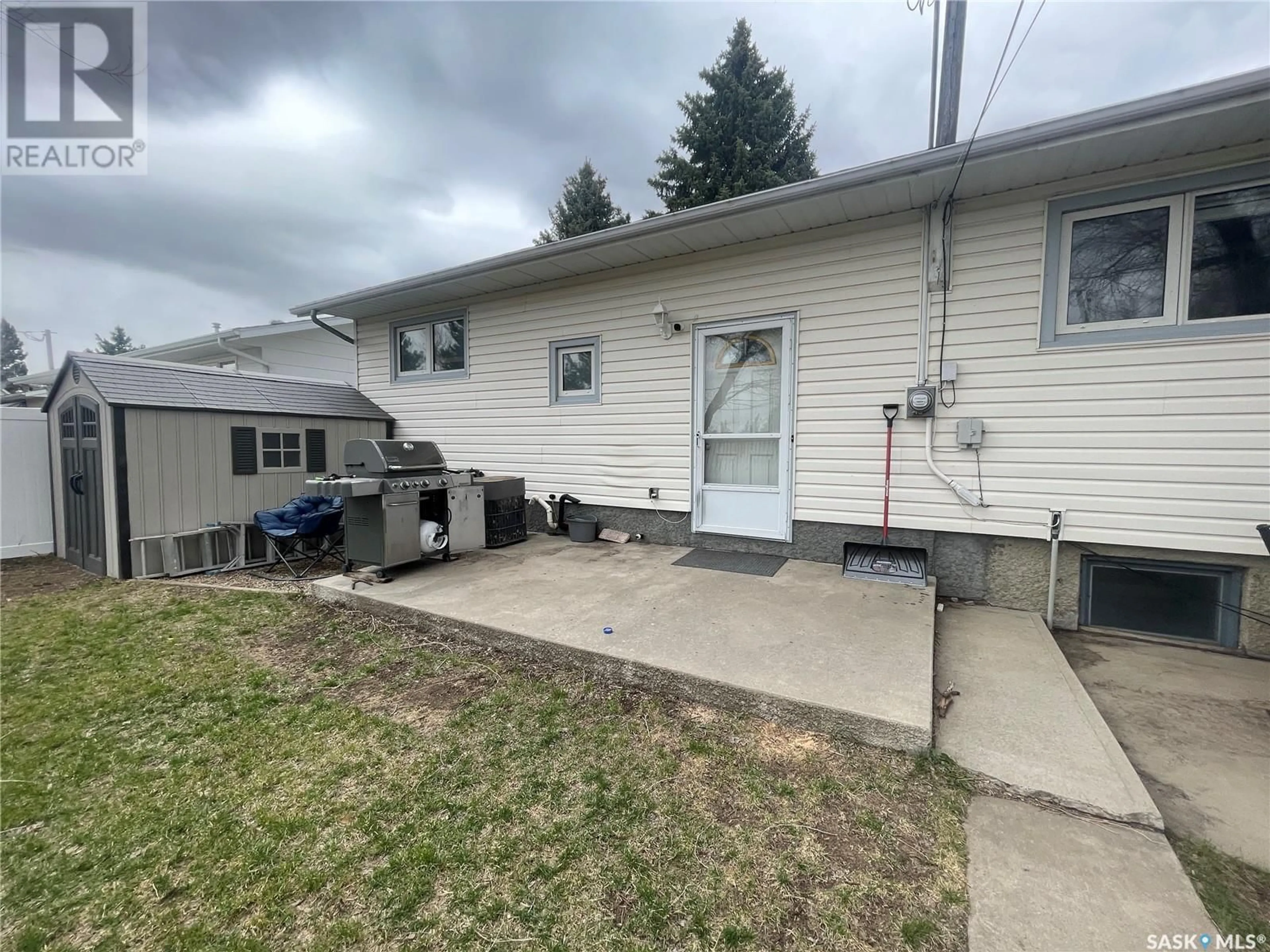 Frontside or backside of a home, the fenced backyard for 735 Jasper STREET, Maple Creek Saskatchewan S0N1N0