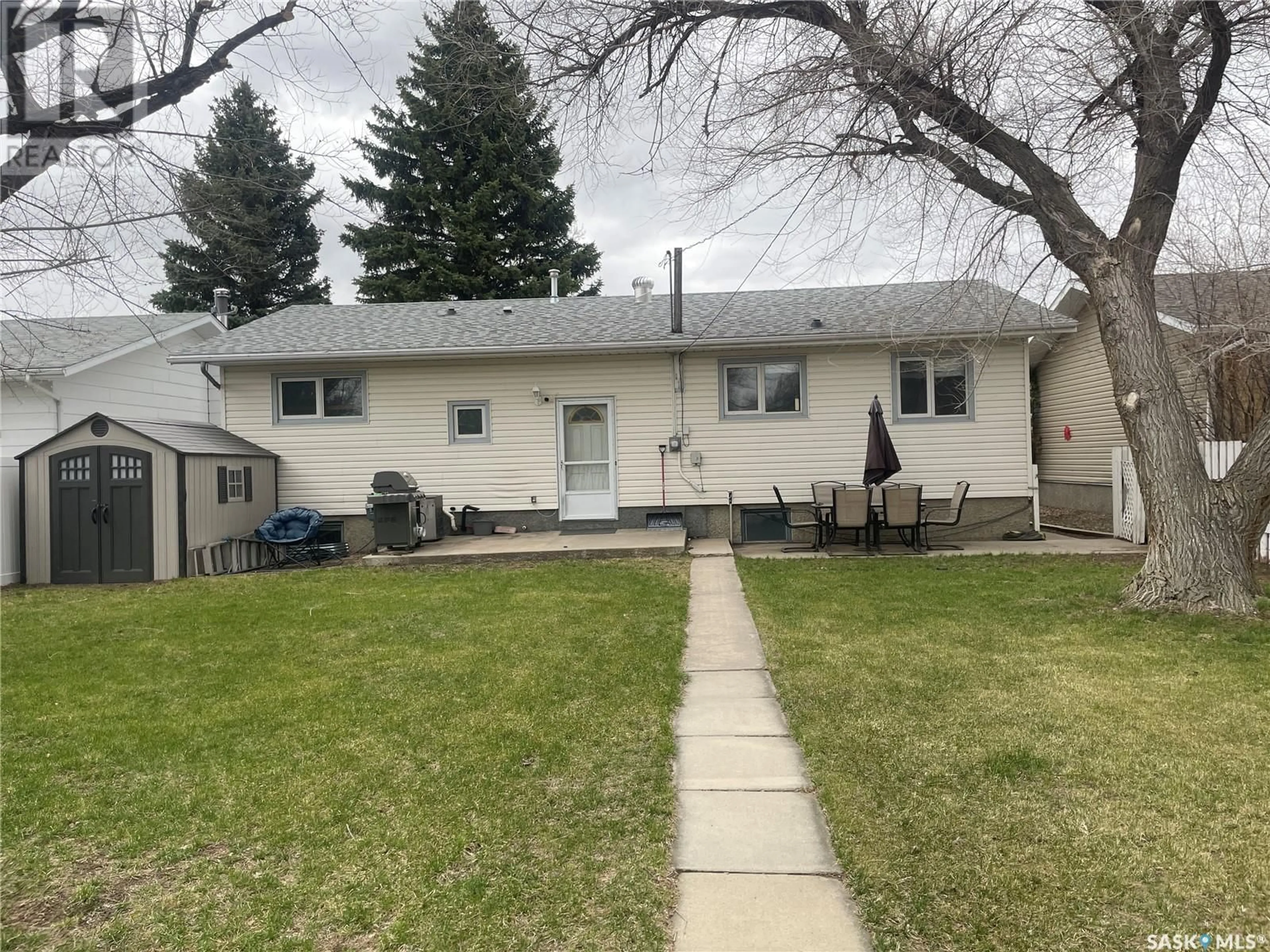 Frontside or backside of a home, the fenced backyard for 735 Jasper STREET, Maple Creek Saskatchewan S0N1N0