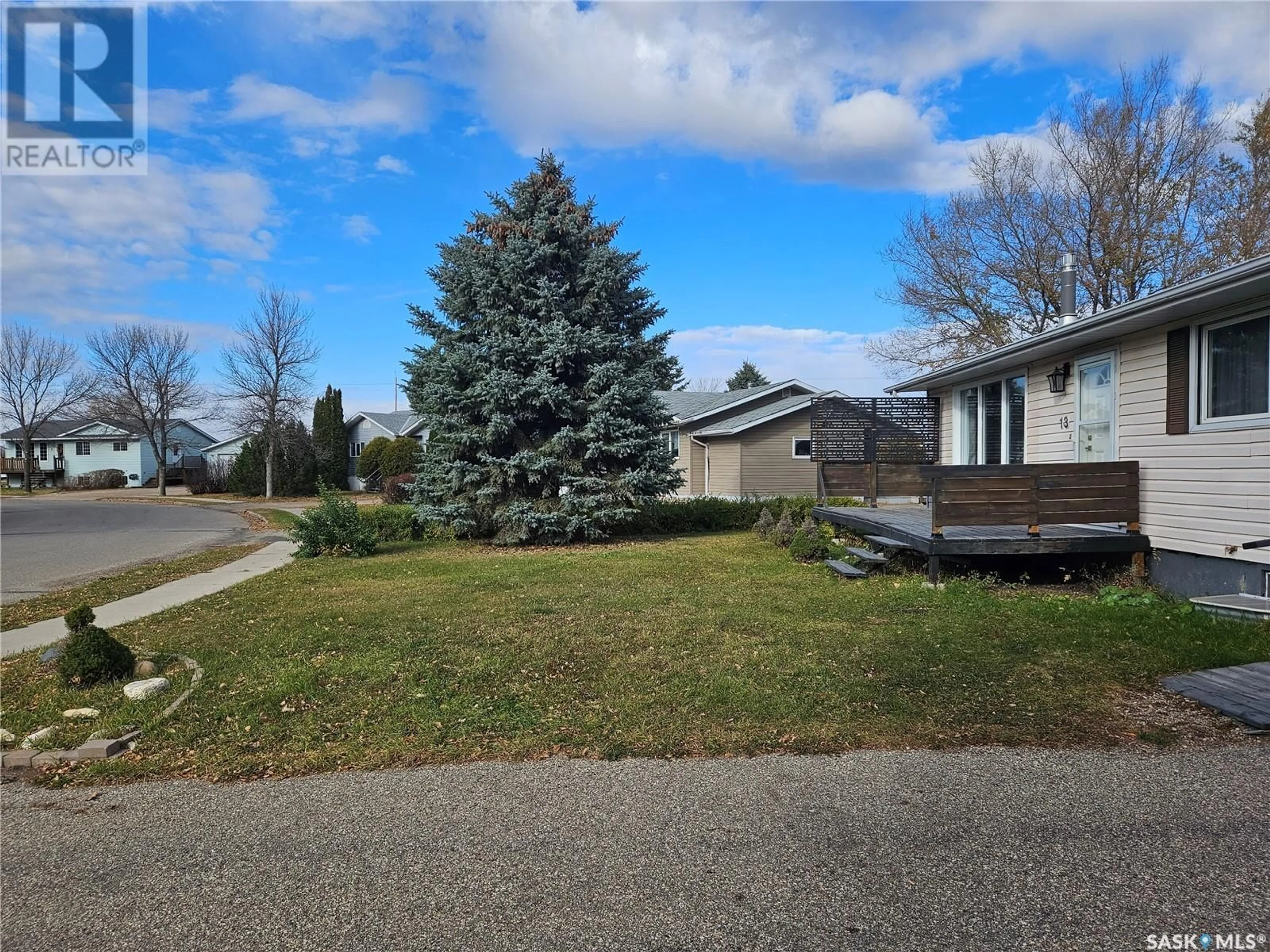 Frontside or backside of a home, the fenced backyard for 13 Mountain DRIVE, Carlyle Saskatchewan S0C0R0