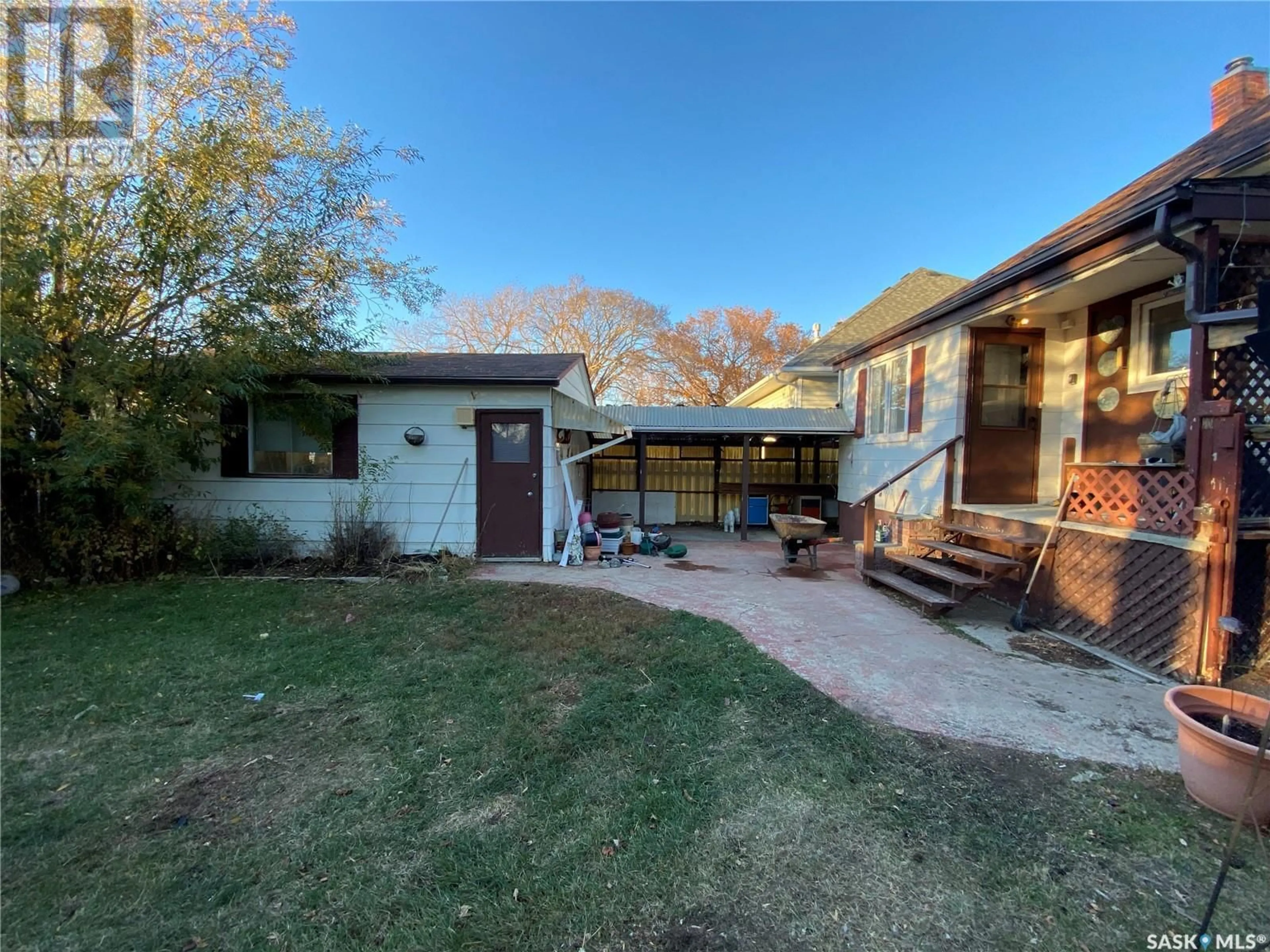 Frontside or backside of a home, the fenced backyard for 702 3RD AVENUE NW, Swift Current Saskatchewan S9H0T1