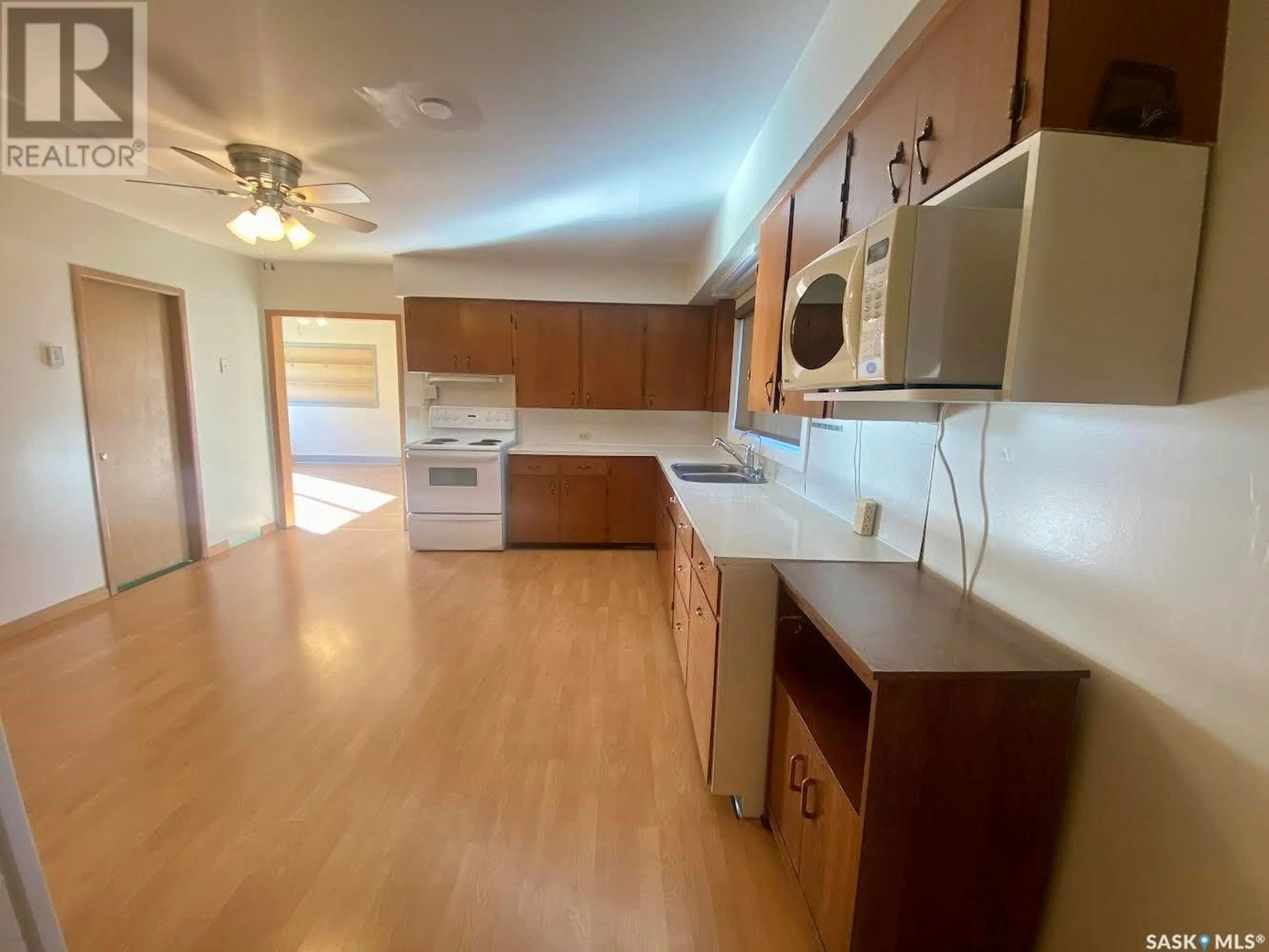 Standard kitchen, wood floors, cottage for 220 Pond Street, Pambrun Saskatchewan S0N1W0