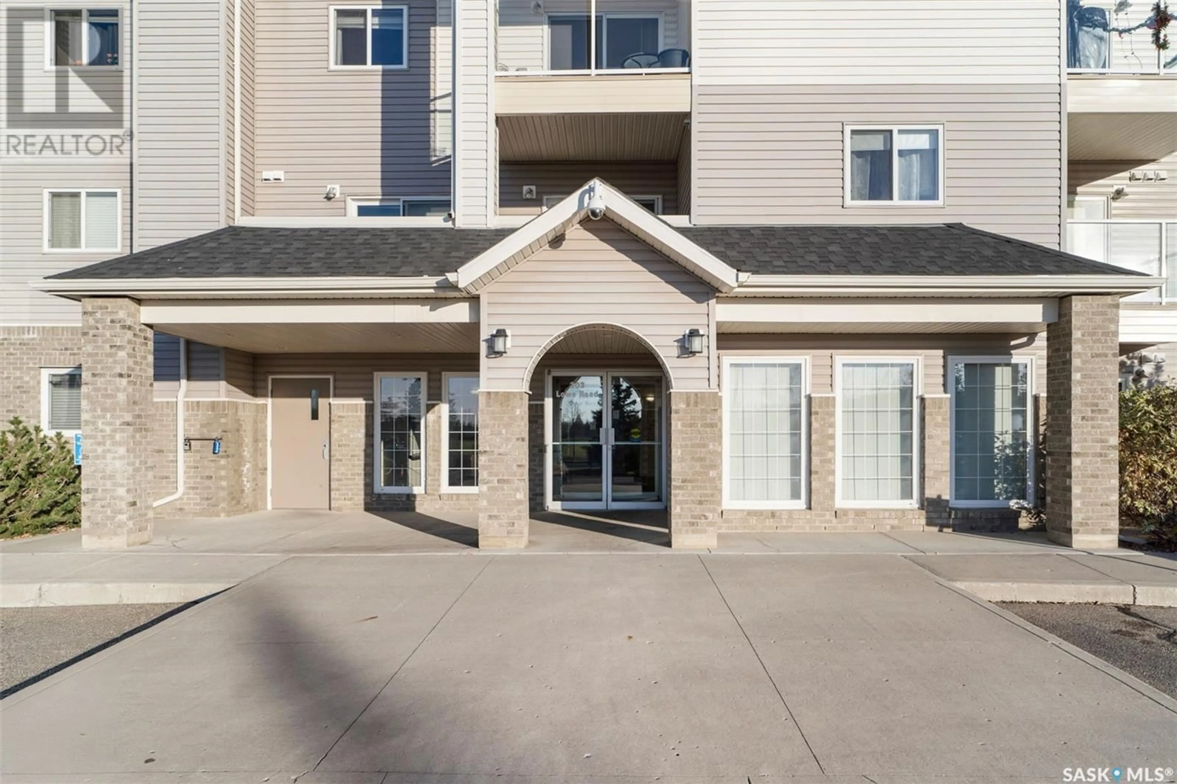 A pic from exterior of the house or condo, the front or back of building for 111 303 Lowe ROAD, Saskatoon Saskatchewan S7S1P2