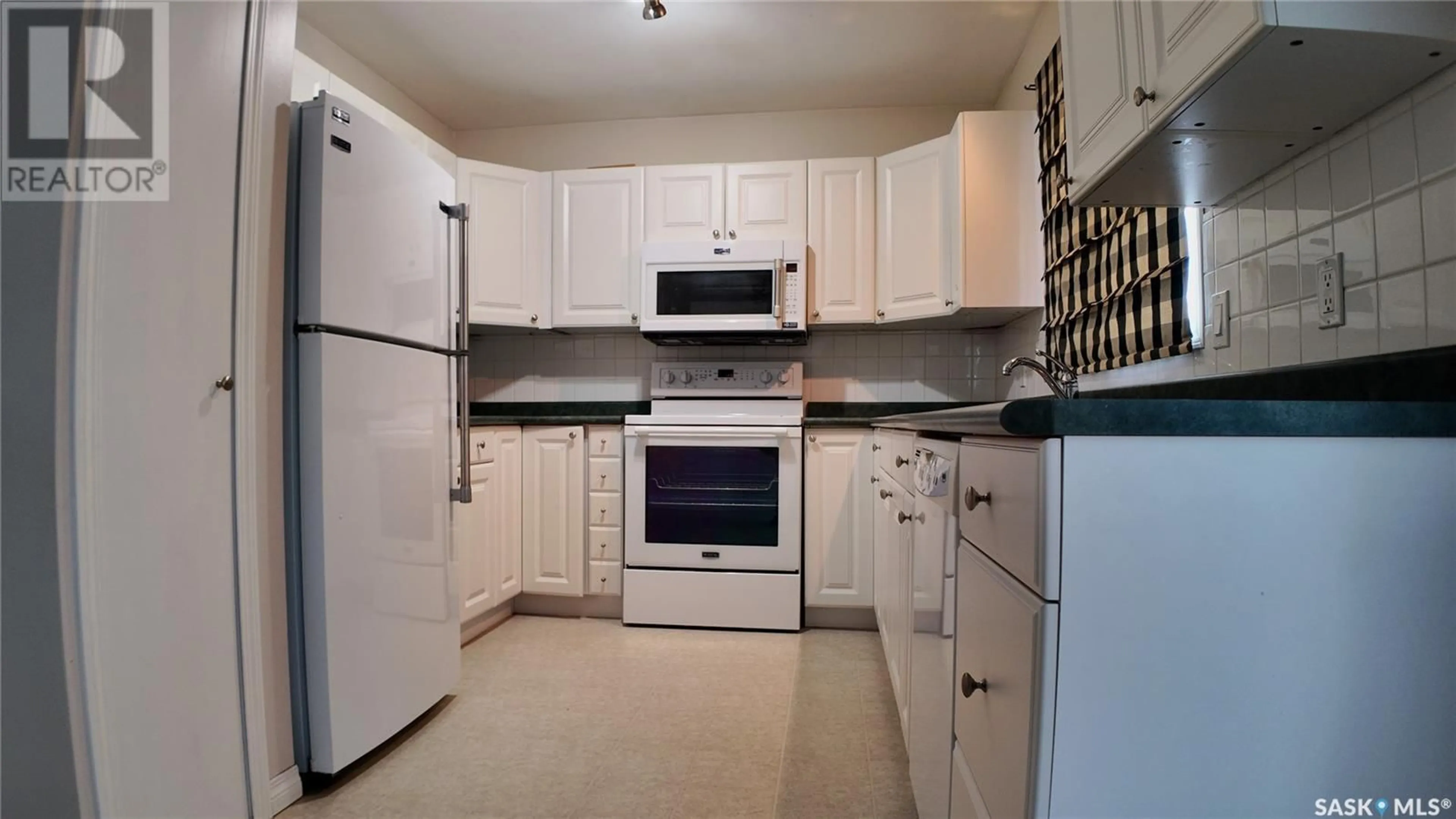 Standard kitchen, wood floors, cottage for 2128 101st CRESCENT, North Battleford Saskatchewan S9A1C3