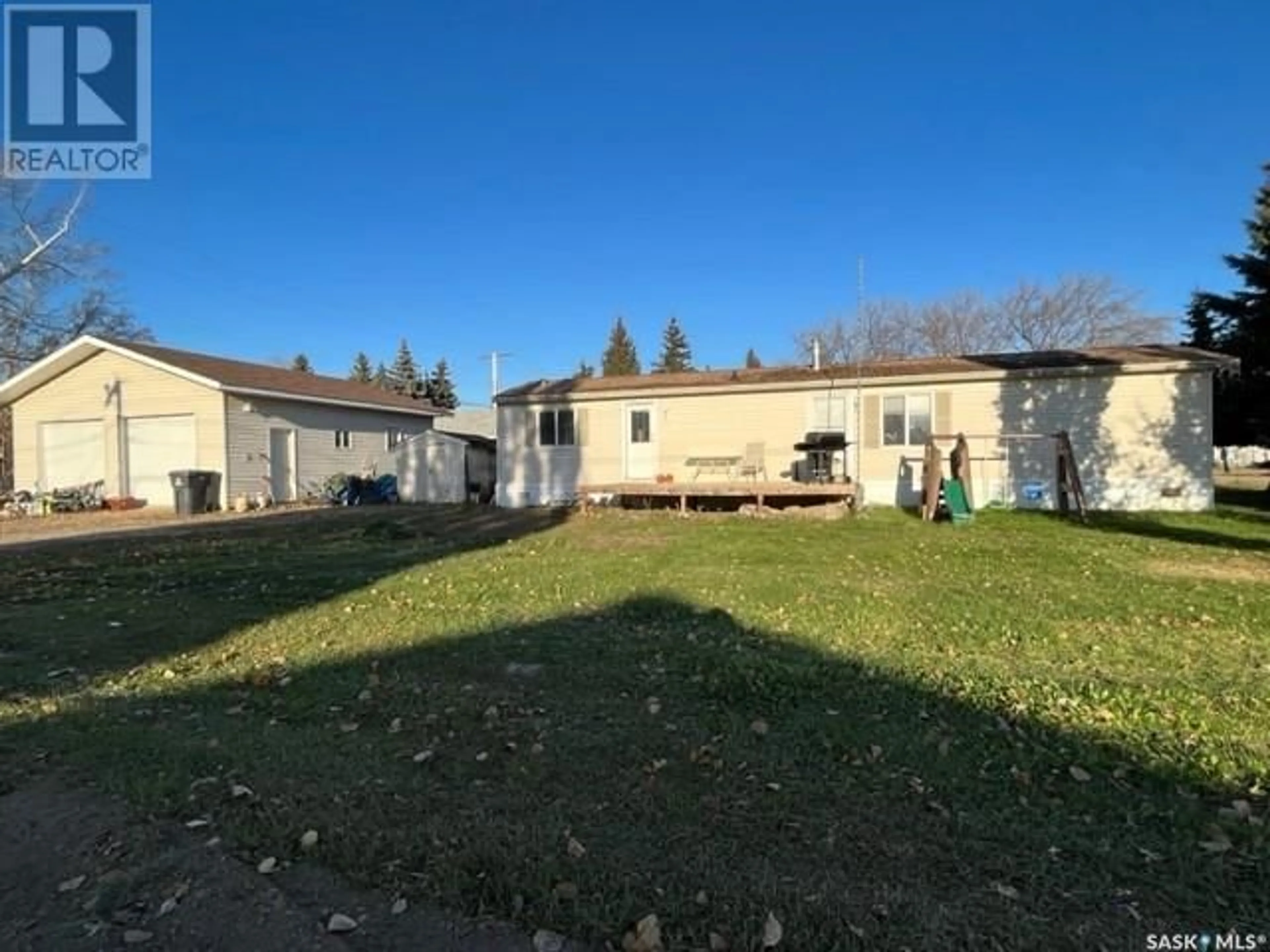 Frontside or backside of a home, the fenced backyard for 205 2nd STREET E, Meota Saskatchewan S0M1X0