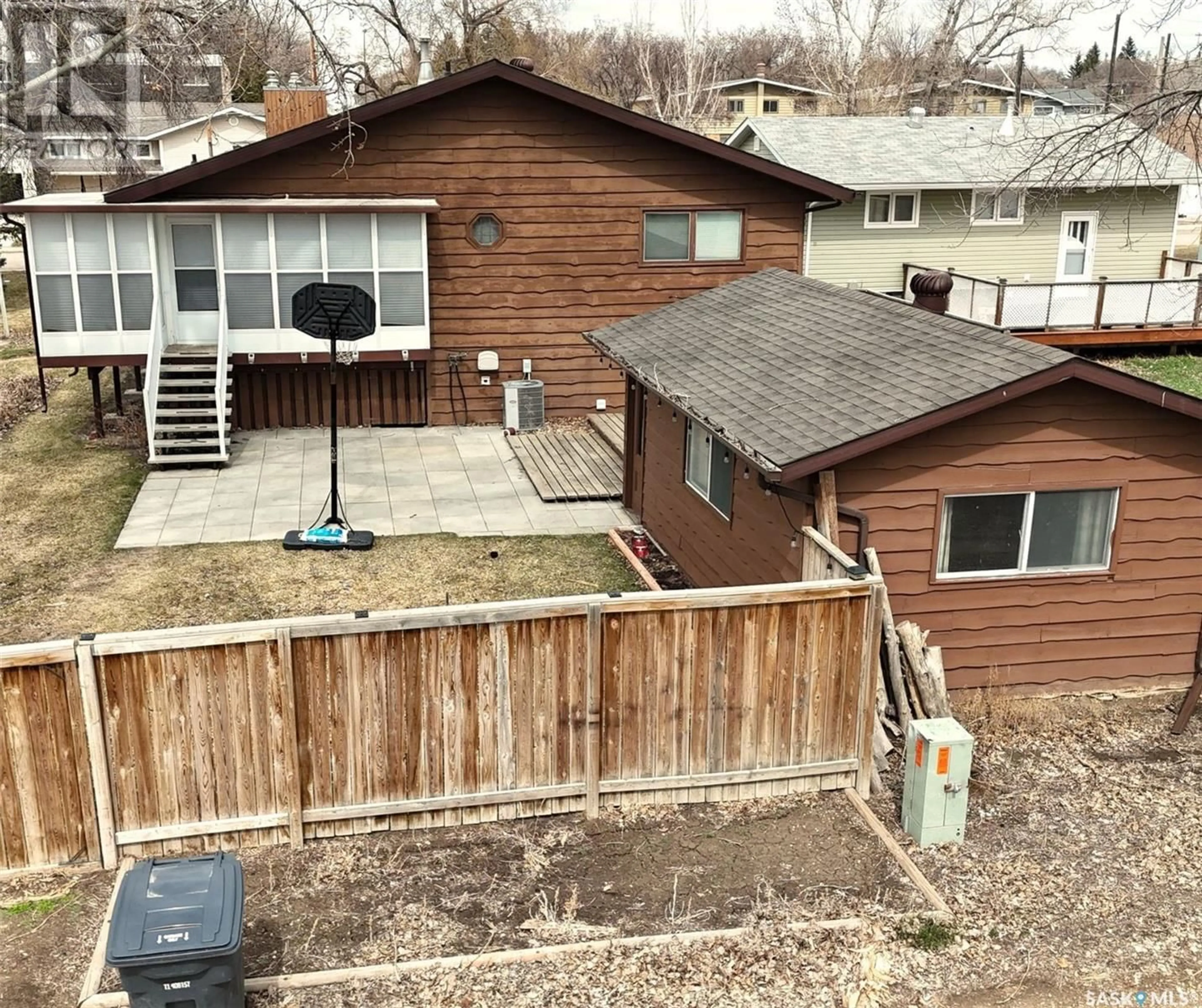 Frontside or backside of a home, the fenced backyard for 1224 Walker STREET, Swift Current Saskatchewan S9H1H2