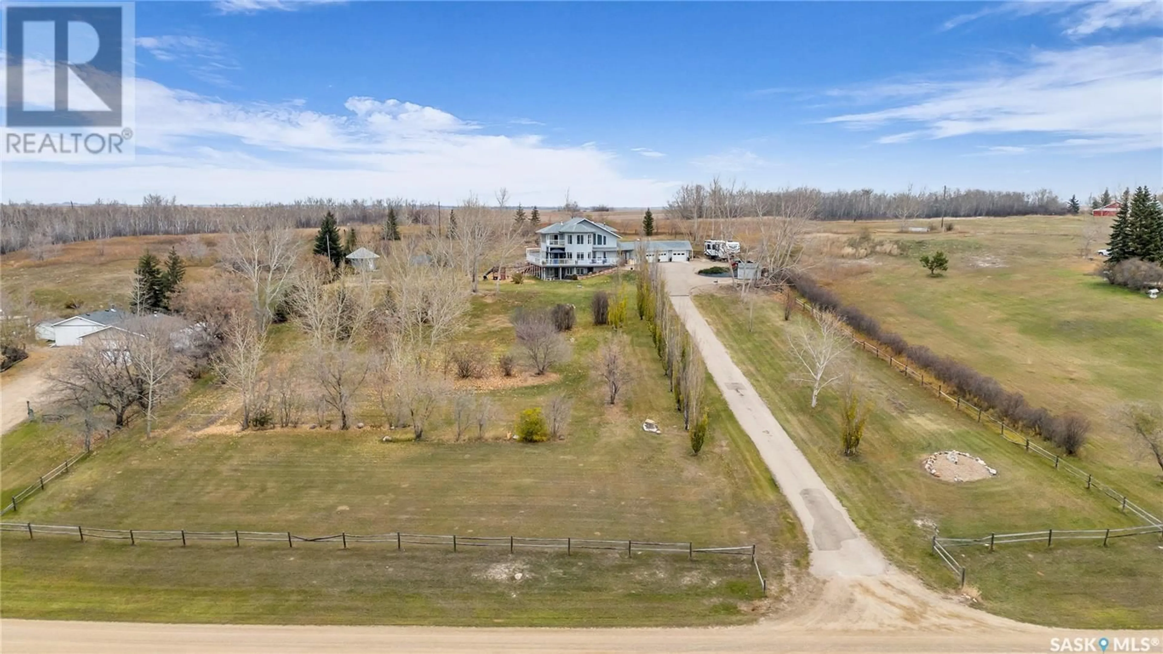 A pic from exterior of the house or condo, the fenced backyard for Island View Acreage, North Battleford Rm No. 437 Saskatchewan S9A2X4