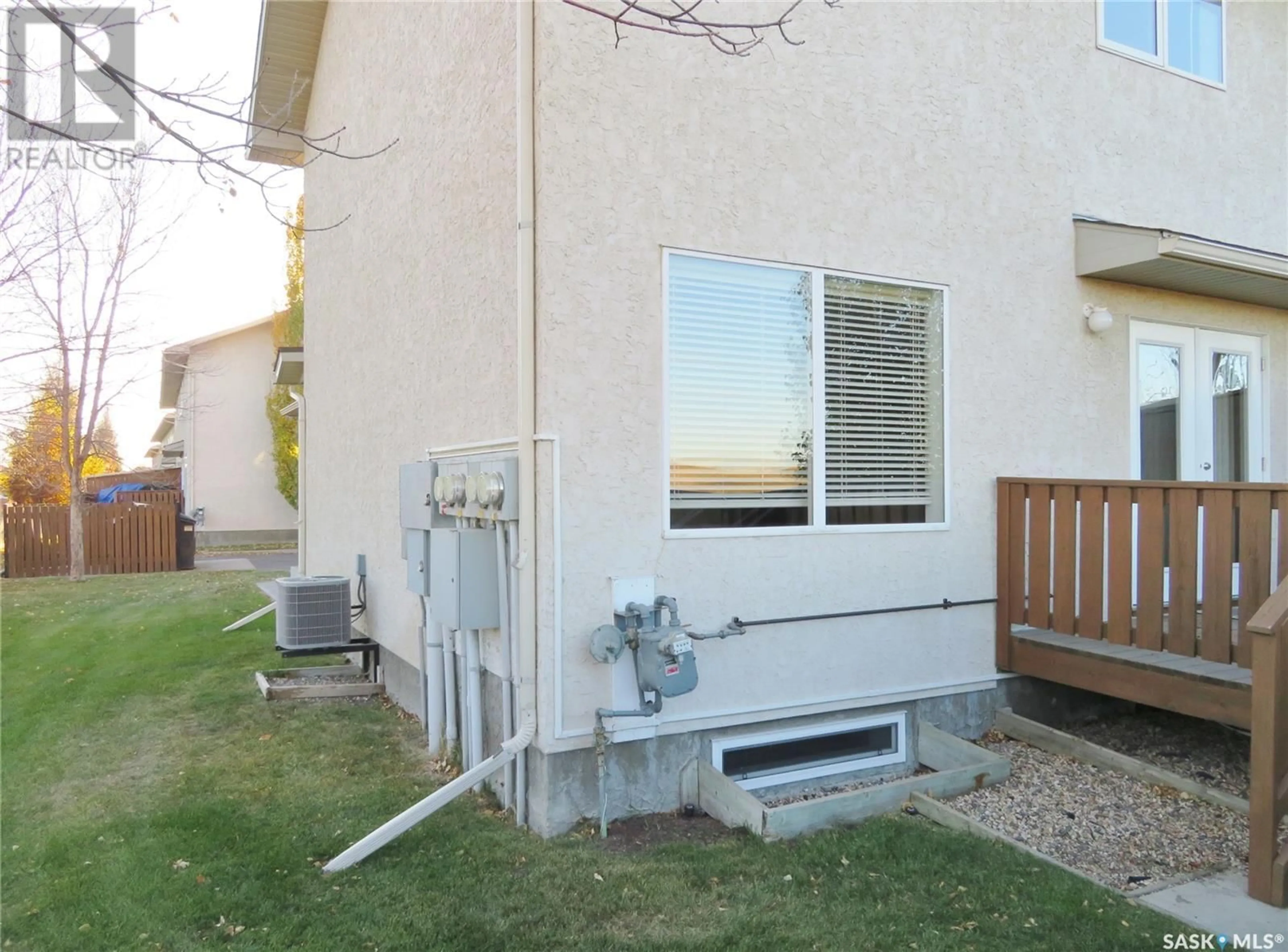 A pic from exterior of the house or condo, the fenced backyard for 123 445 Bayfield CRESCENT, Saskatoon Saskatchewan S7V1J1