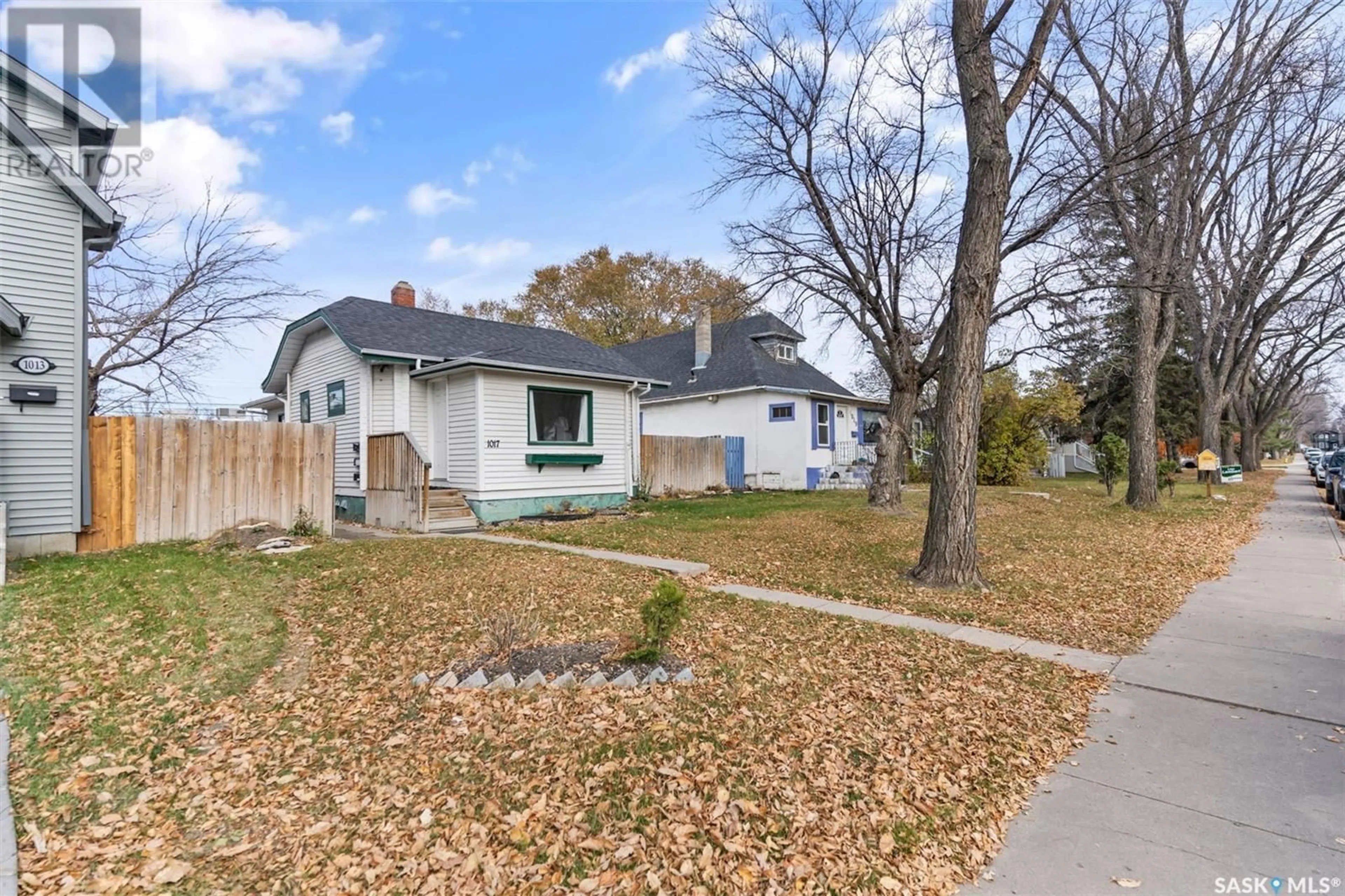 Frontside or backside of a home, the fenced backyard for 1017 7th STREET E, Saskatoon Saskatchewan S7H0Y7