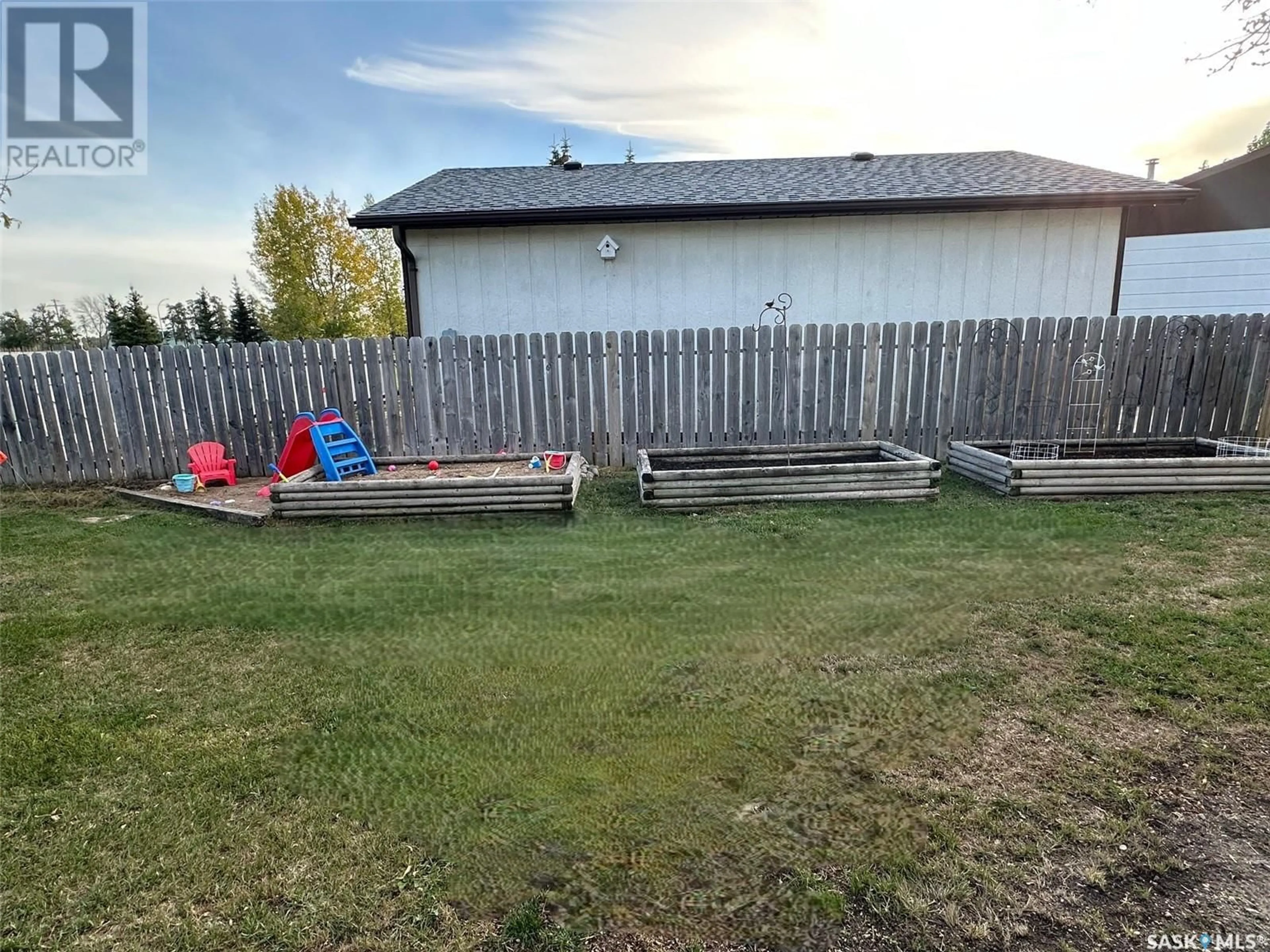 Patio, the fenced backyard for 737 Willow PLACE, Hudson Bay Saskatchewan S0E0Y0