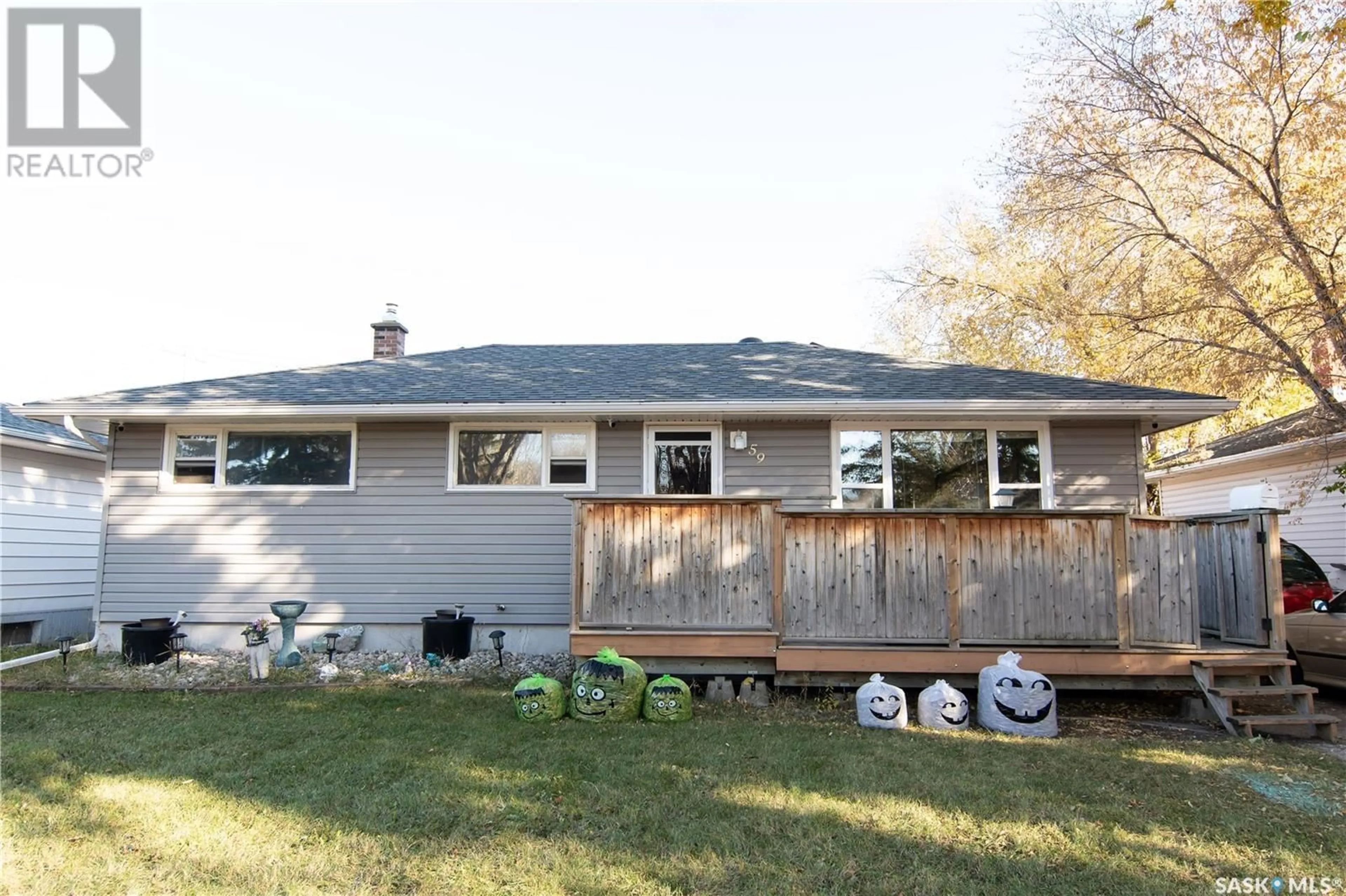 Frontside or backside of a home, the fenced backyard for 59 Yarnton CRESCENT, Regina Saskatchewan S4R4A1