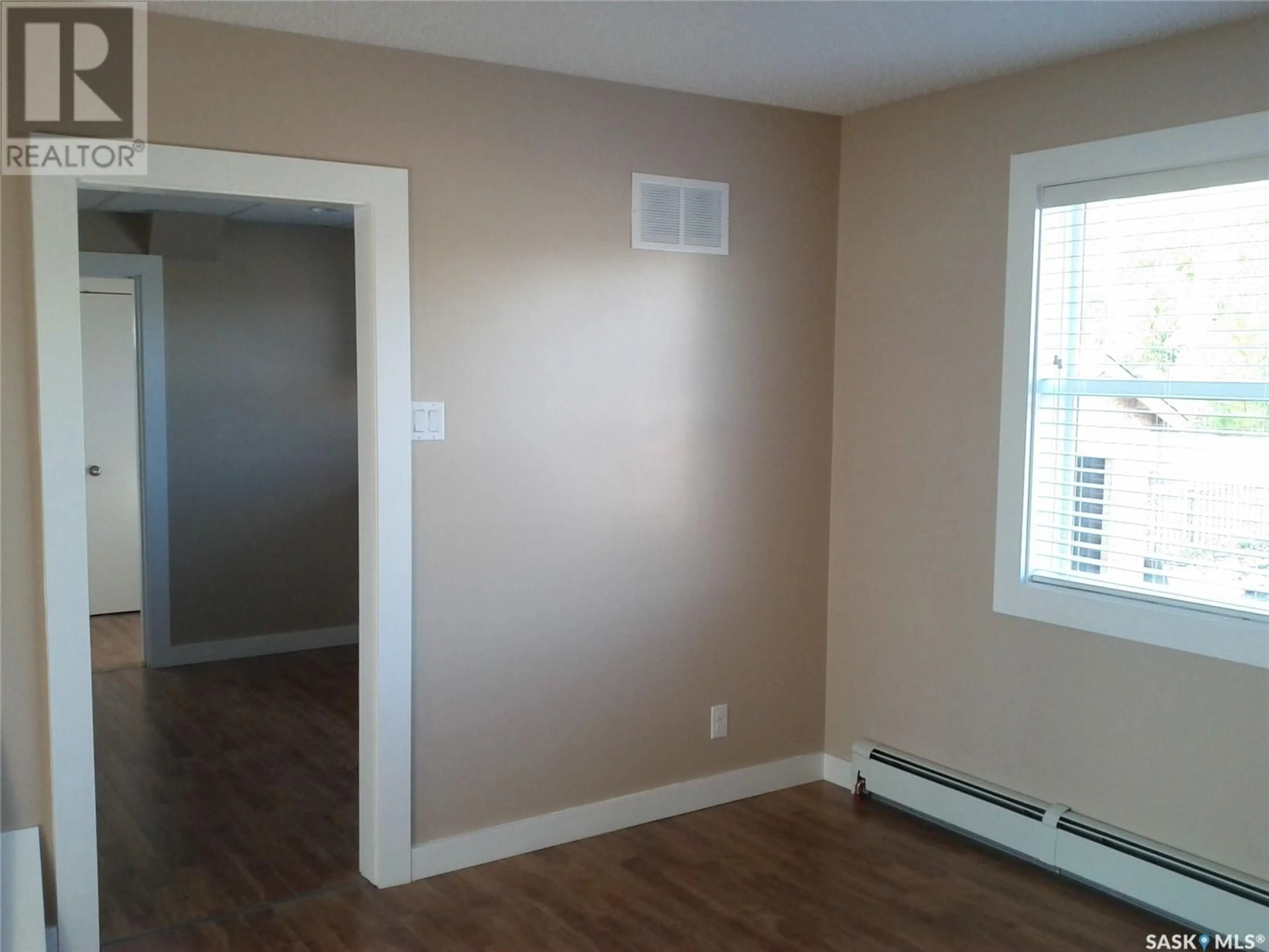 A pic of a room, wood floors for 410 & 412 4th AVENUE, Rosthern Saskatchewan S0K3R0