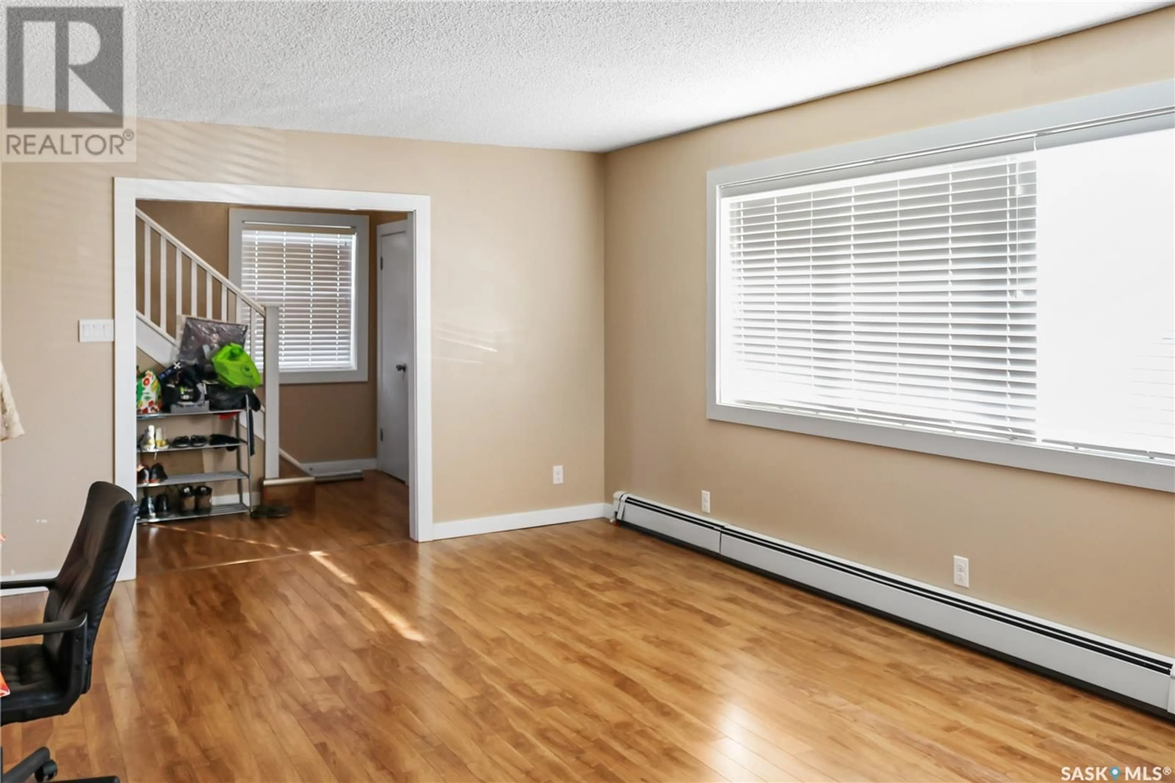 A pic of a room, wood floors for 410 & 412 4th AVENUE, Rosthern Saskatchewan S0K3R0