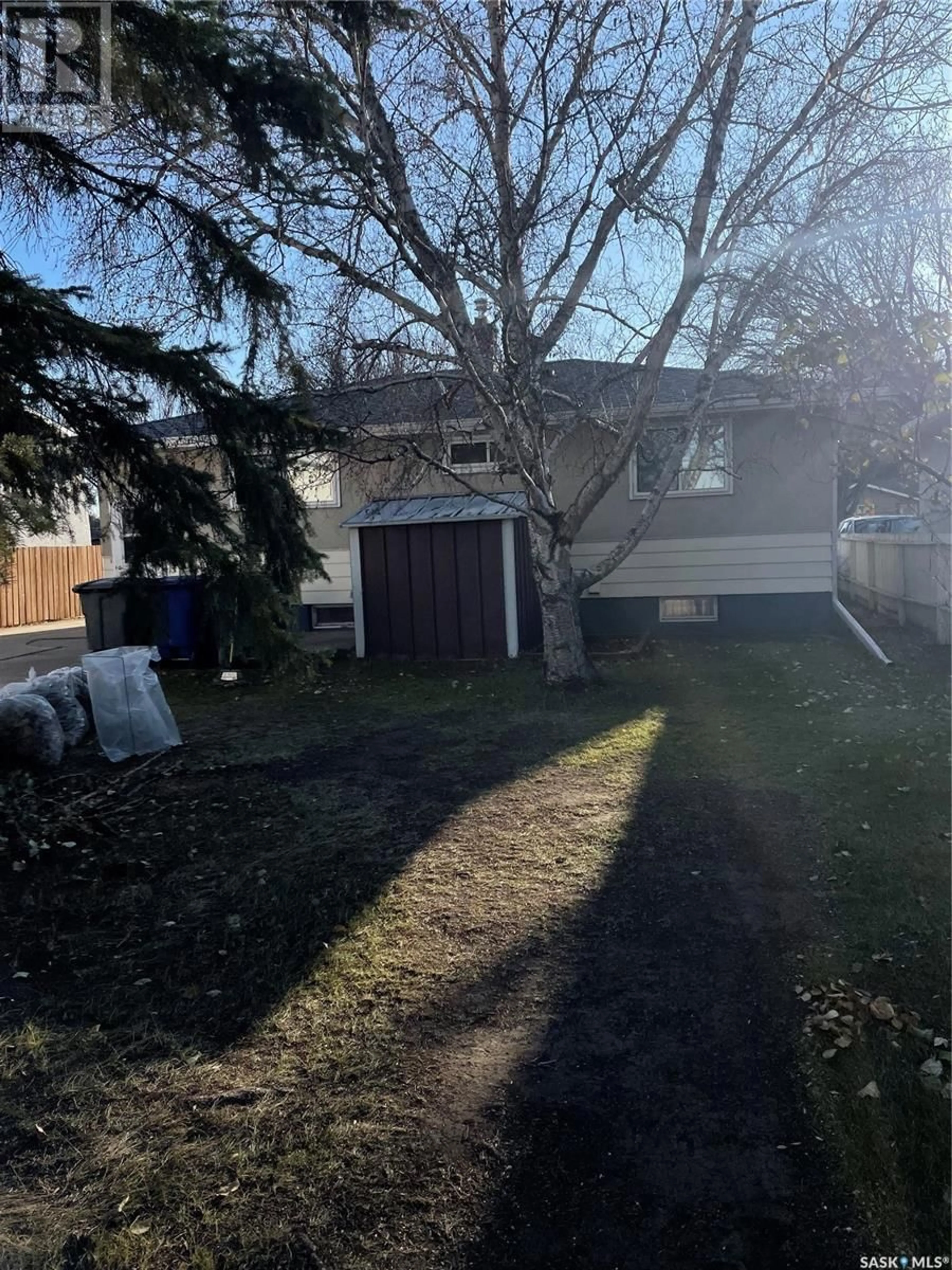 Frontside or backside of a home, the fenced backyard for 288 Carleton DRIVE, Saskatoon Saskatchewan S7H4C1