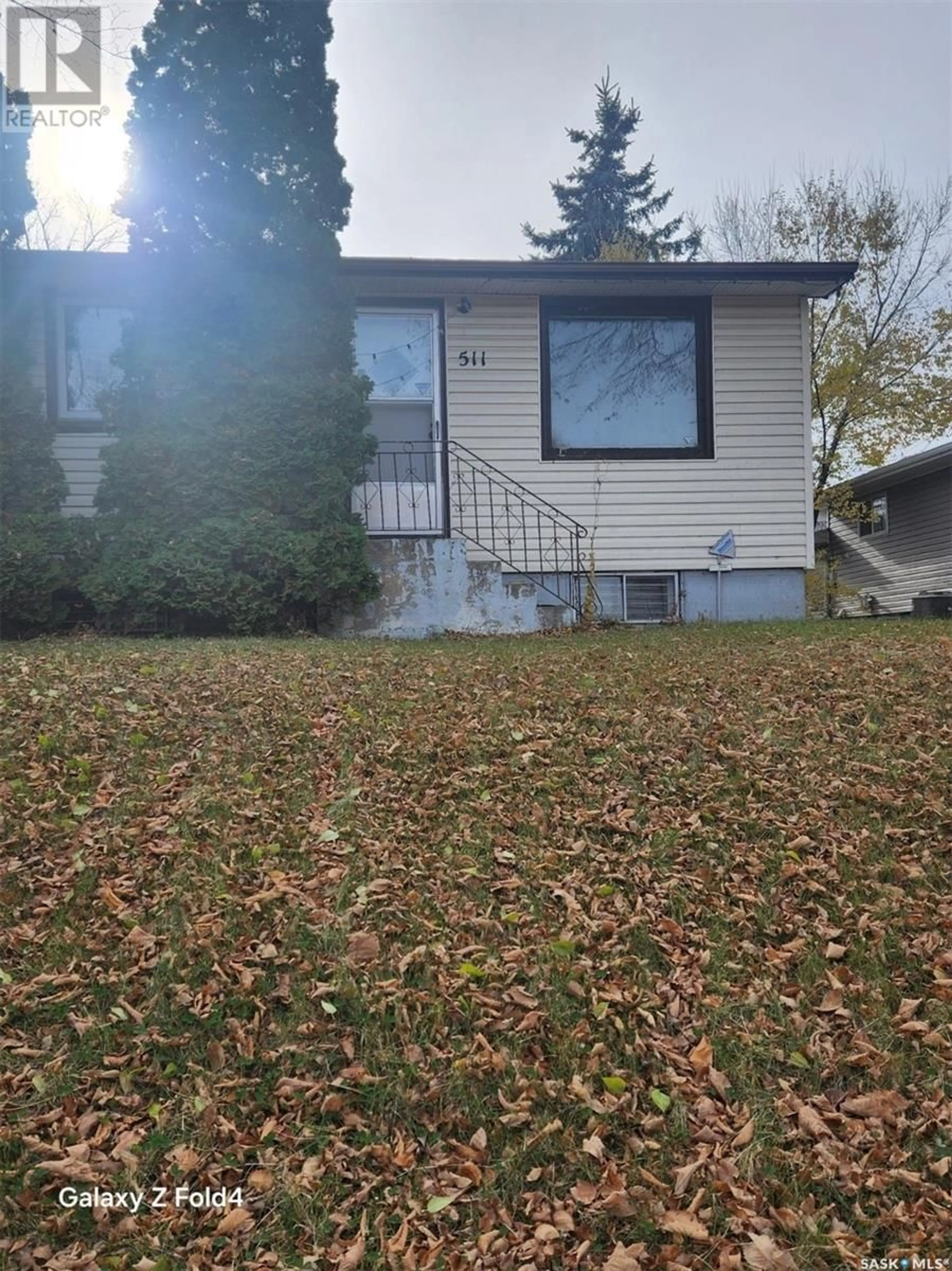 Frontside or backside of a home, the fenced backyard for 511 20th STREET E, Prince Albert Saskatchewan S6V1L4