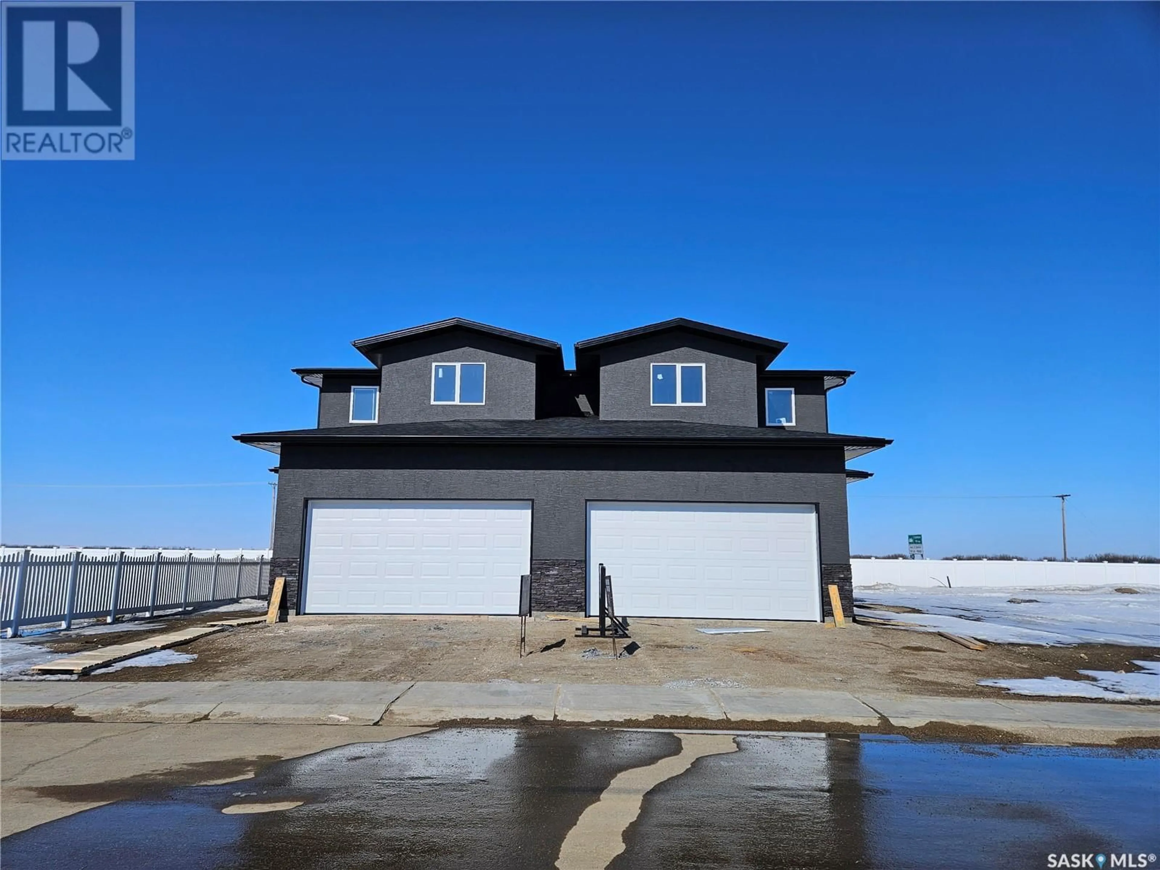 A pic from outside/outdoor area/front of a property/back of a property/a pic from drone, unknown for 848 DELAET BAY, Warman Saskatchewan S0K0A1