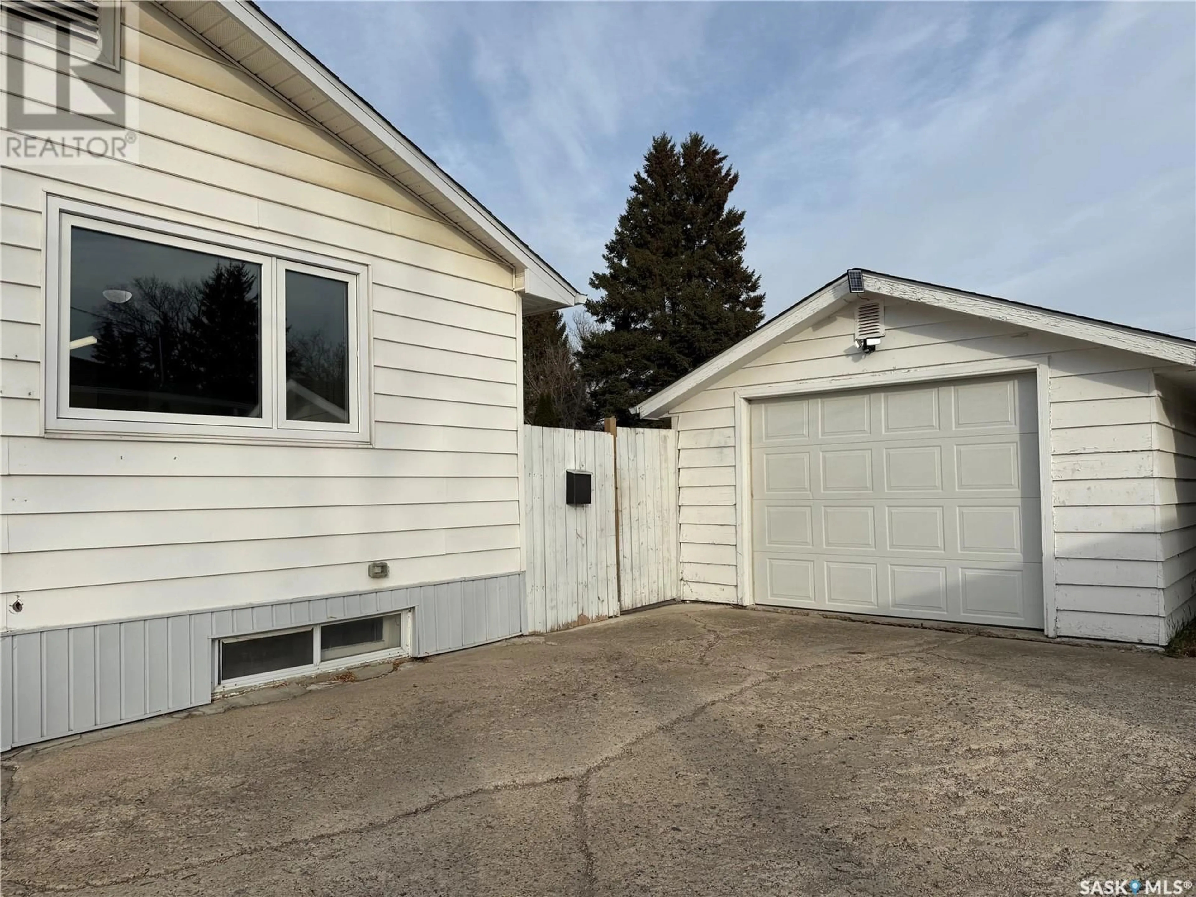 Frontside or backside of a home, the fenced backyard for 251 Fifth AVENUE N, Yorkton Saskatchewan S3N0Z7