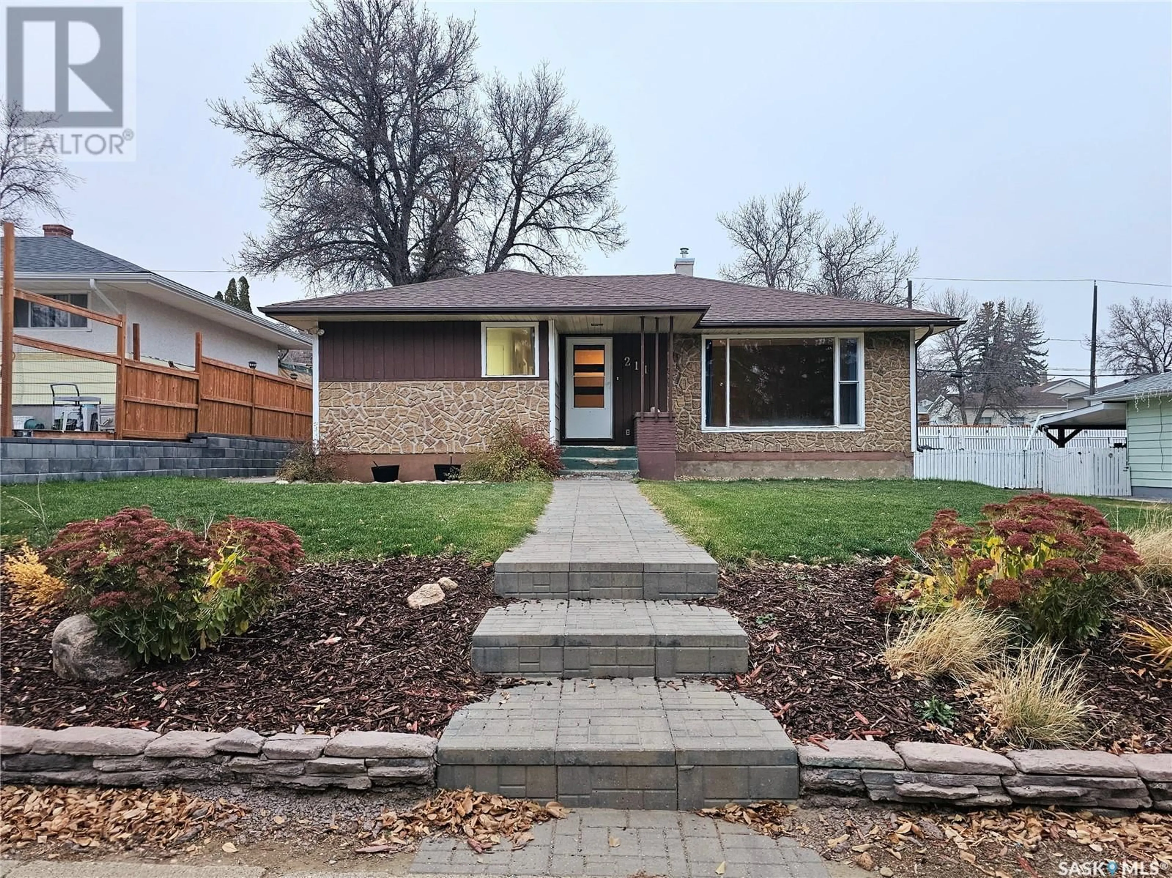 Home with brick exterior material for 211 Ashford STREET E, Swift Current Saskatchewan S9H1Y6