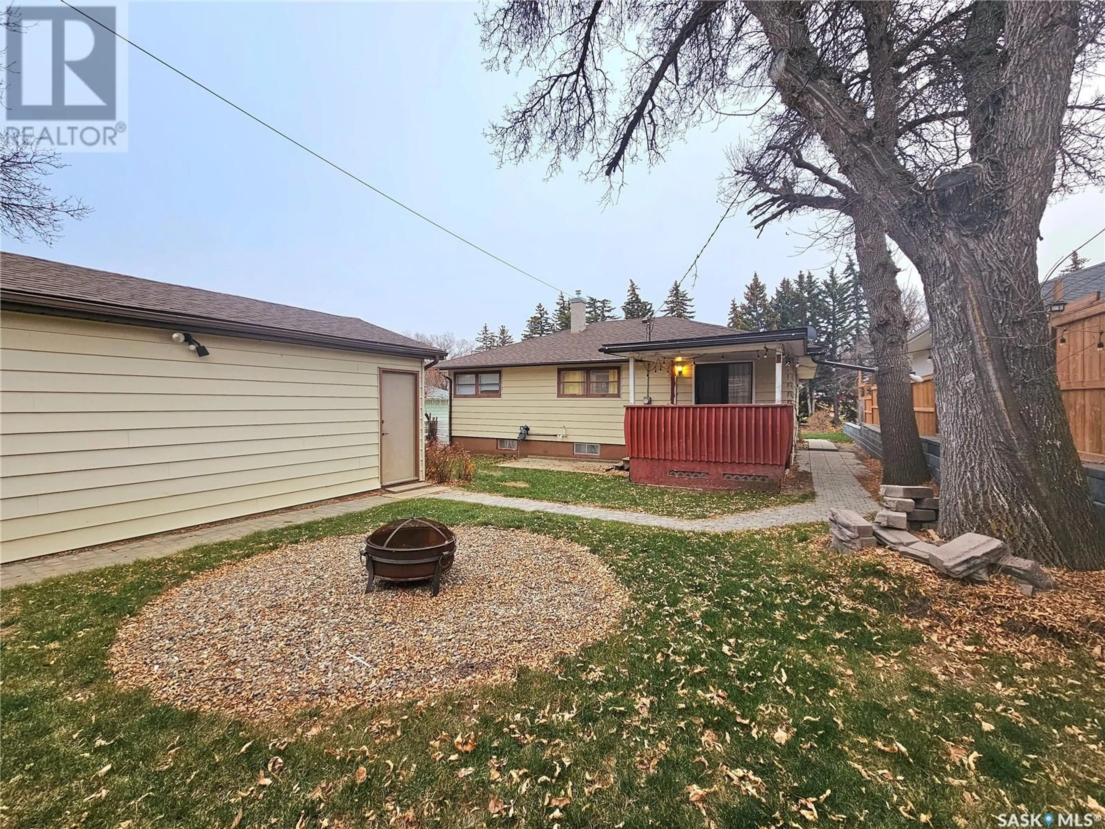 A pic from exterior of the house or condo, the fenced backyard for 211 Ashford STREET E, Swift Current Saskatchewan S9H1Y6