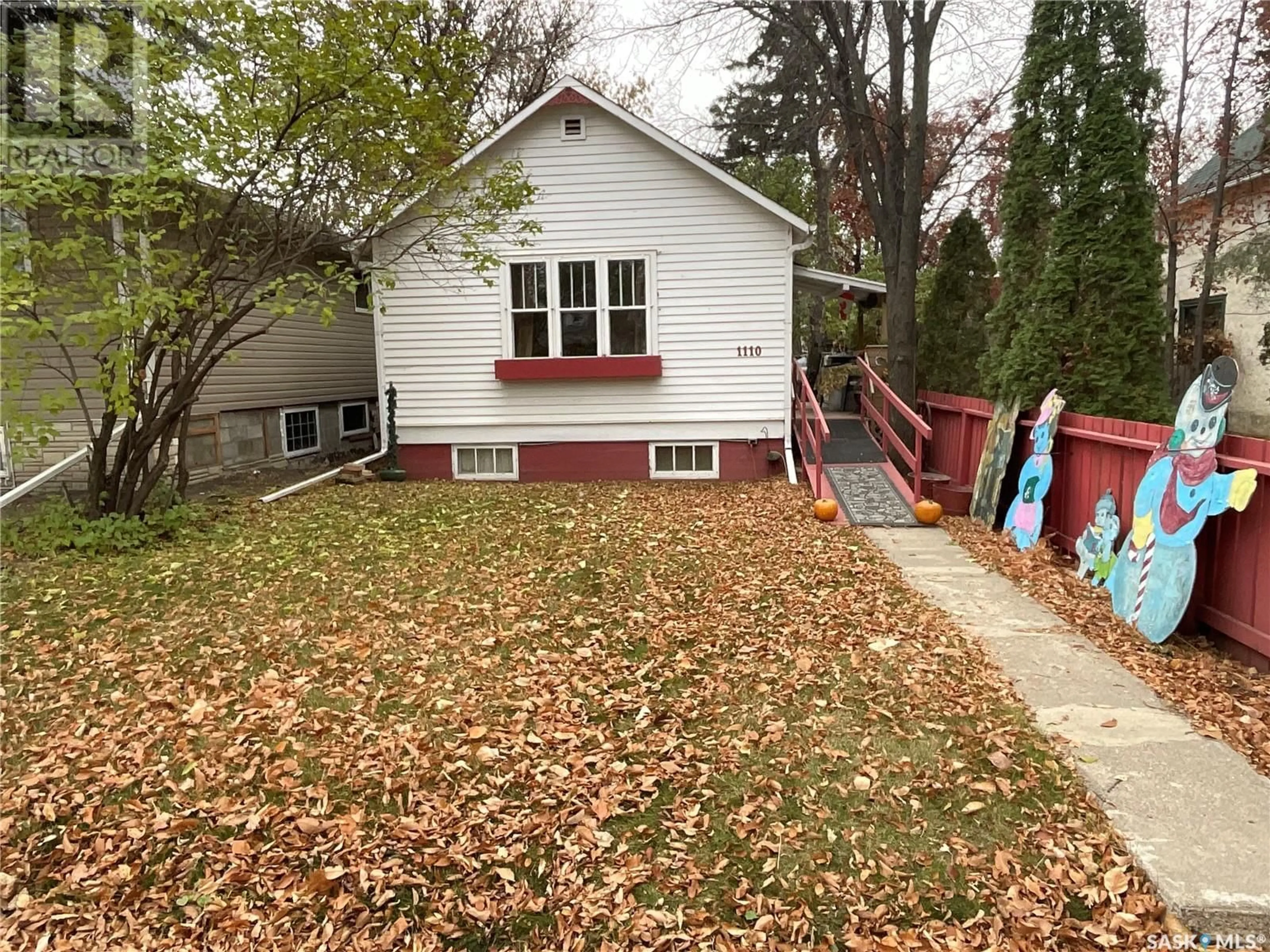 Frontside or backside of a home, the fenced backyard for 1110 12th STREET E, Saskatoon Saskatchewan S7H0E2