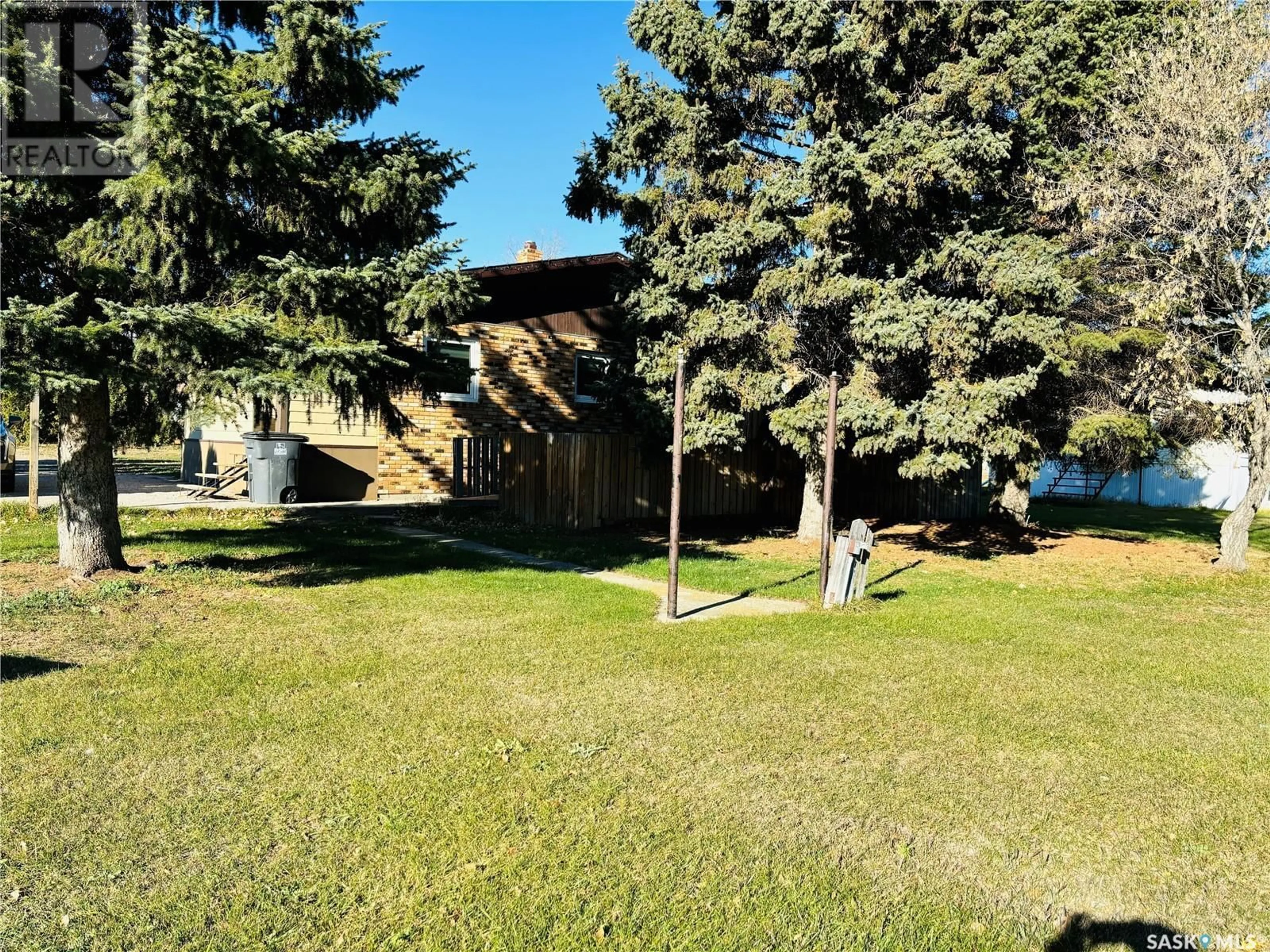 A pic from exterior of the house or condo, the fenced backyard for 103 Main STREET, Hitchcock Saskatchewan S0C1P0