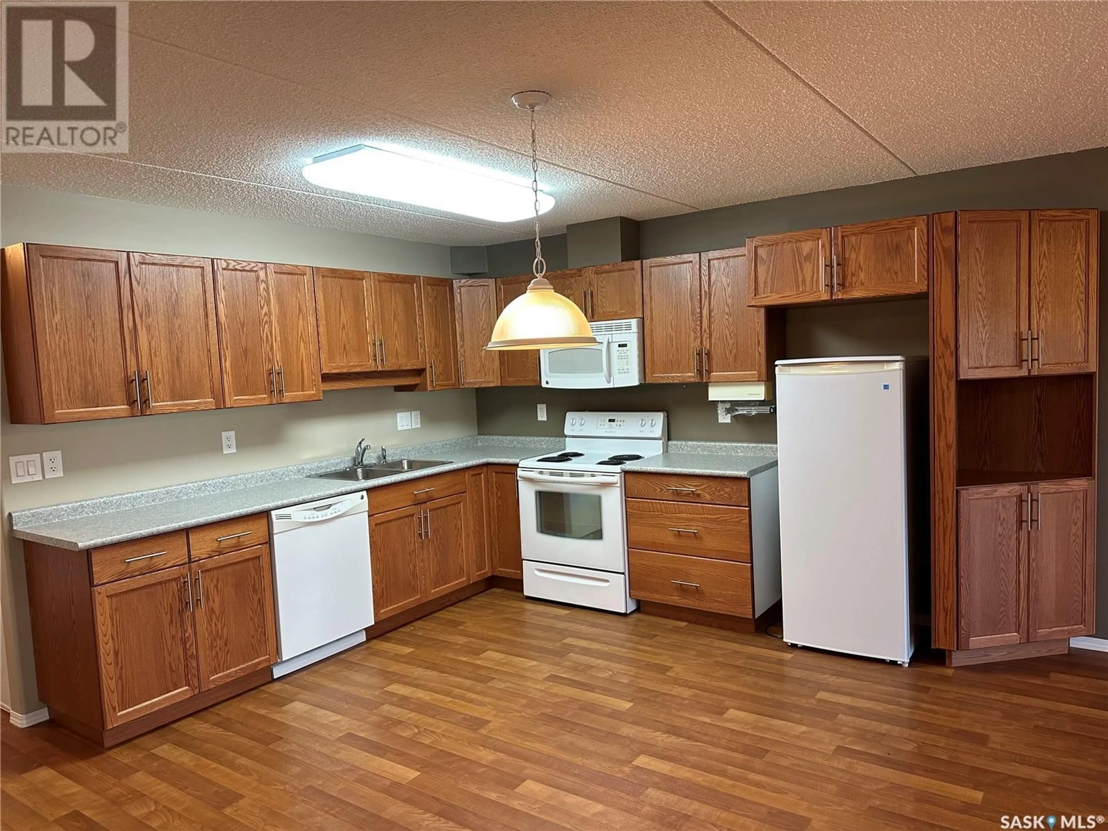 Standard kitchen, wood floors, cottage for 205 2006 7th STREET, Rosthern Saskatchewan S0K3R0