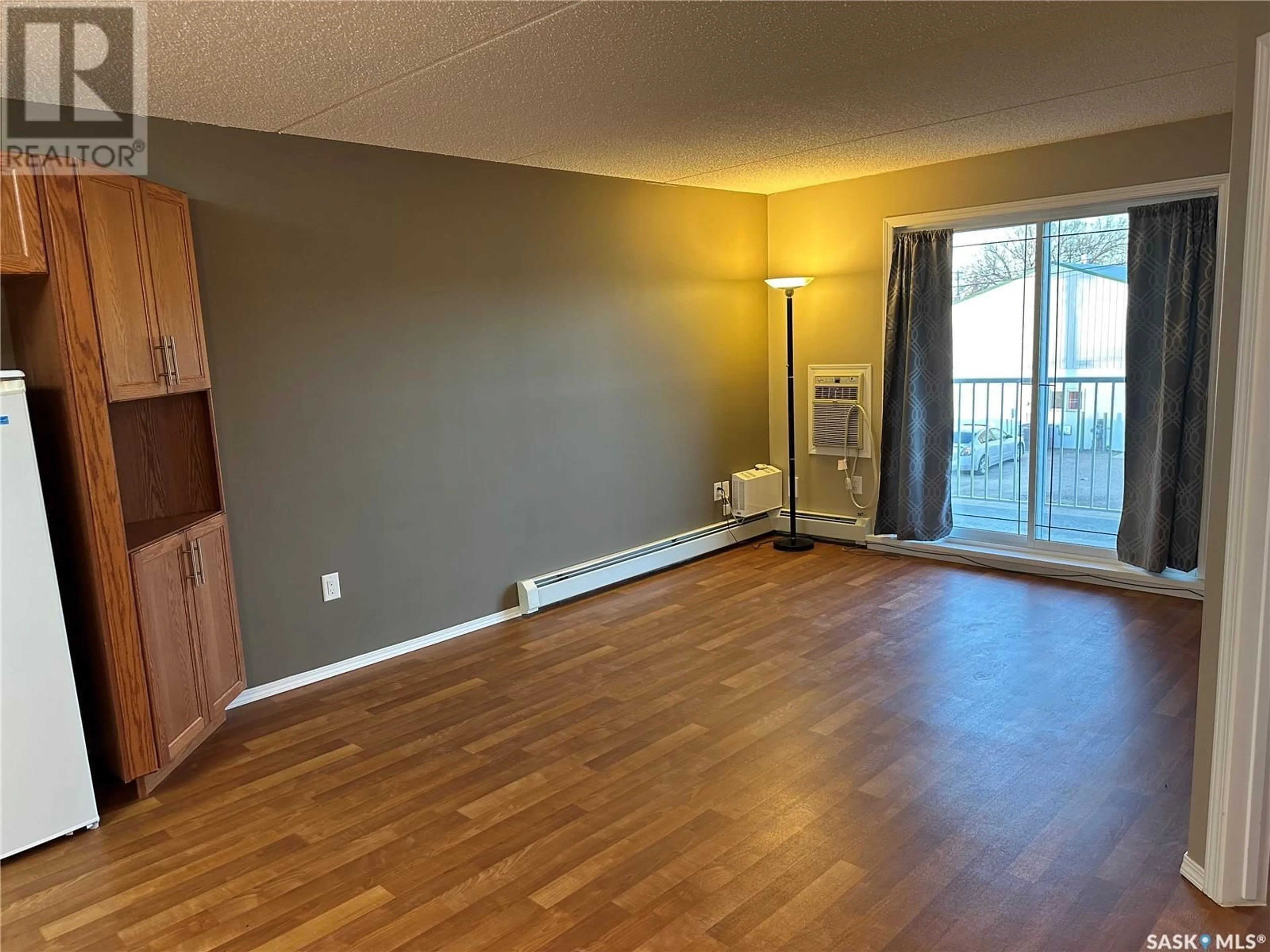 A pic of a room, wood floors for 205 2006 7th STREET, Rosthern Saskatchewan S0K3R0