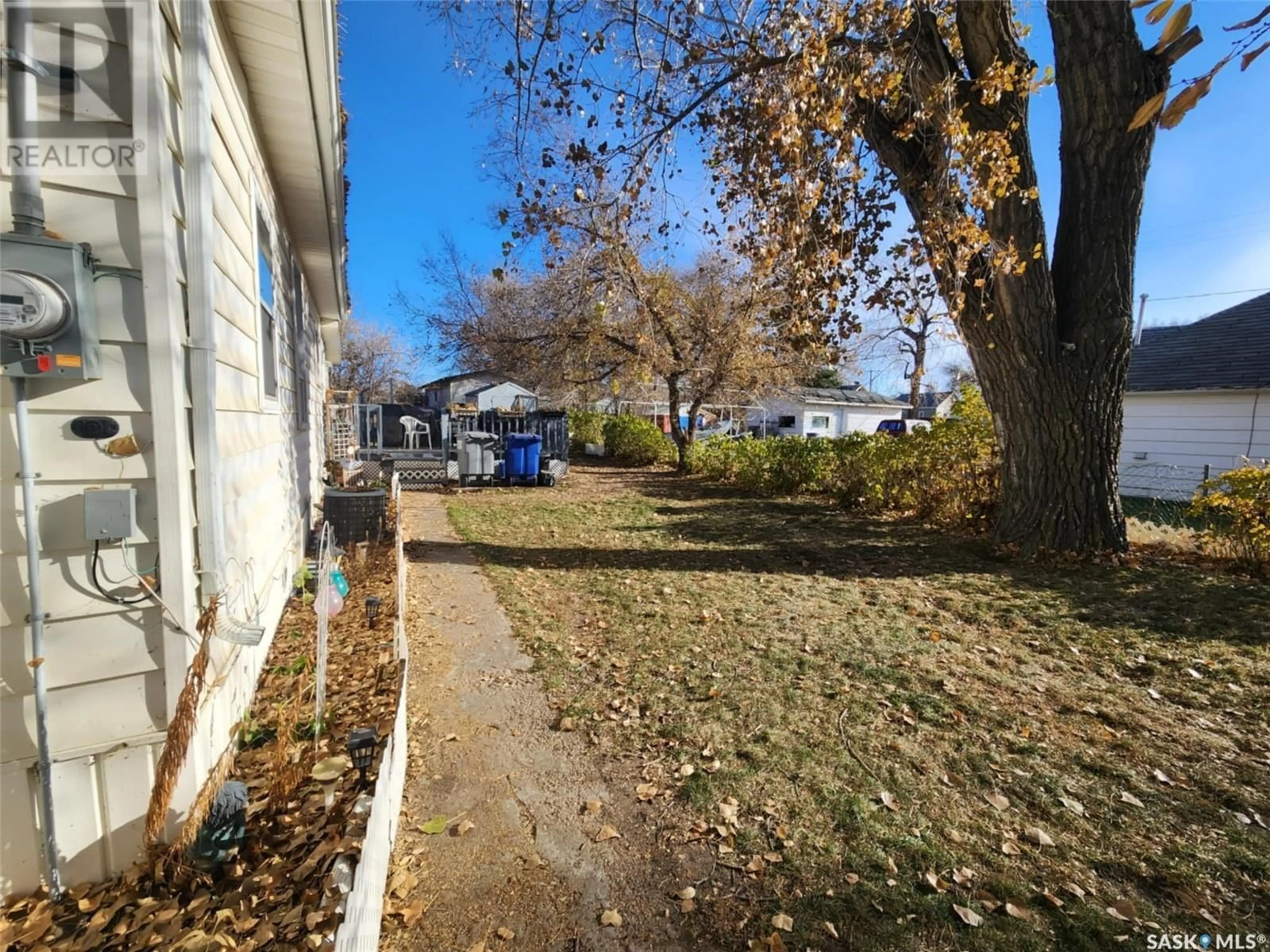 A pic from exterior of the house or condo, the fenced backyard for 317 3rd STREET, Chaplin Saskatchewan S0H0V0